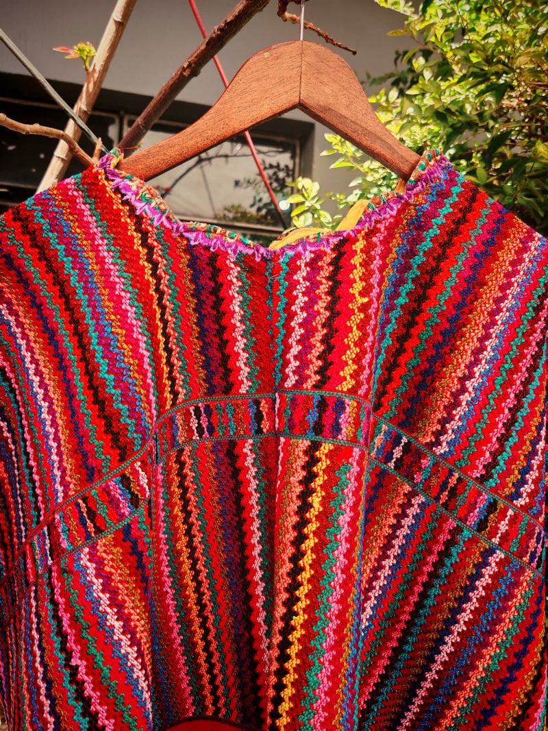 Red zigzag huipil for April