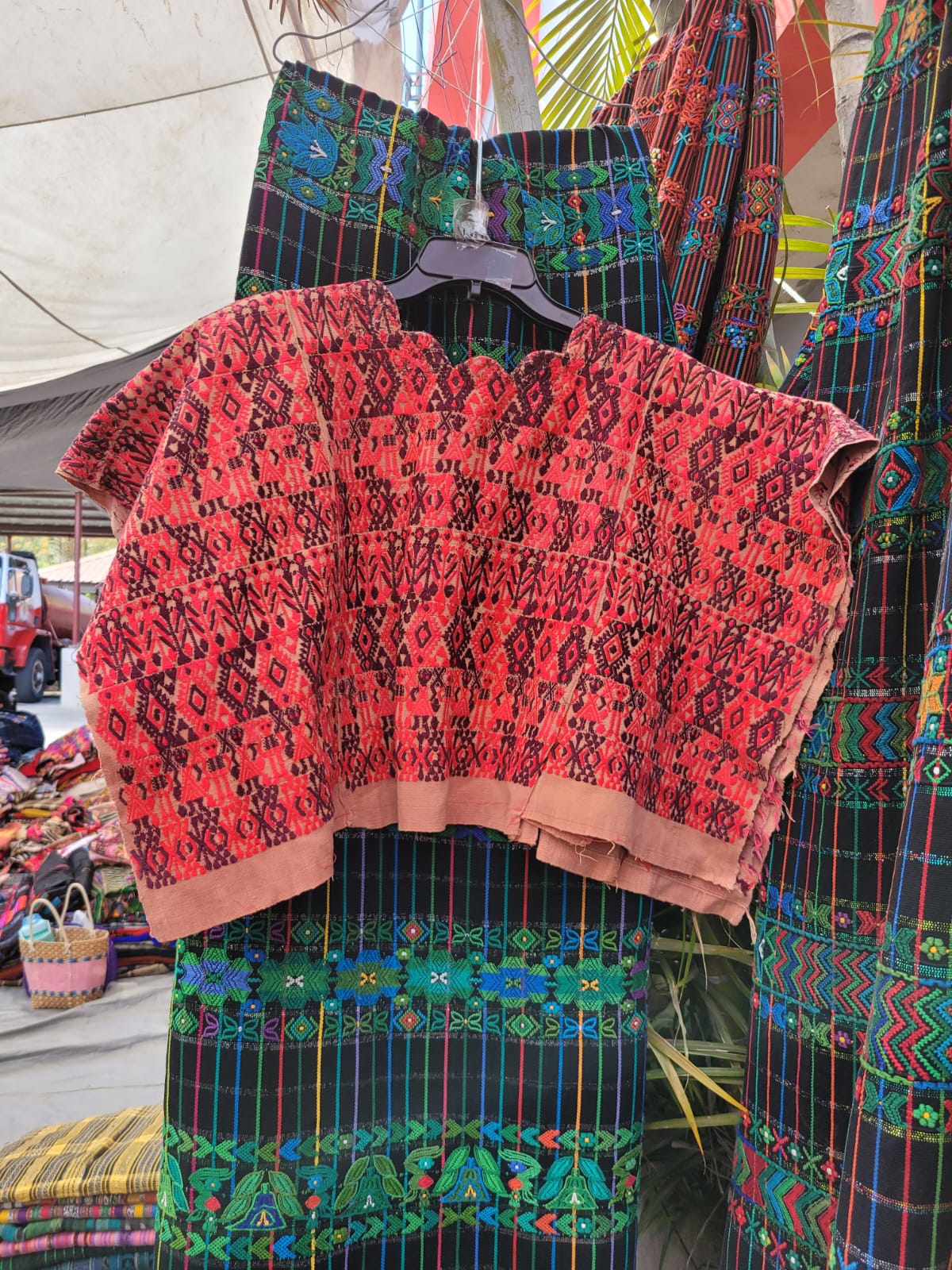 Pink and plum Coban huipil for April