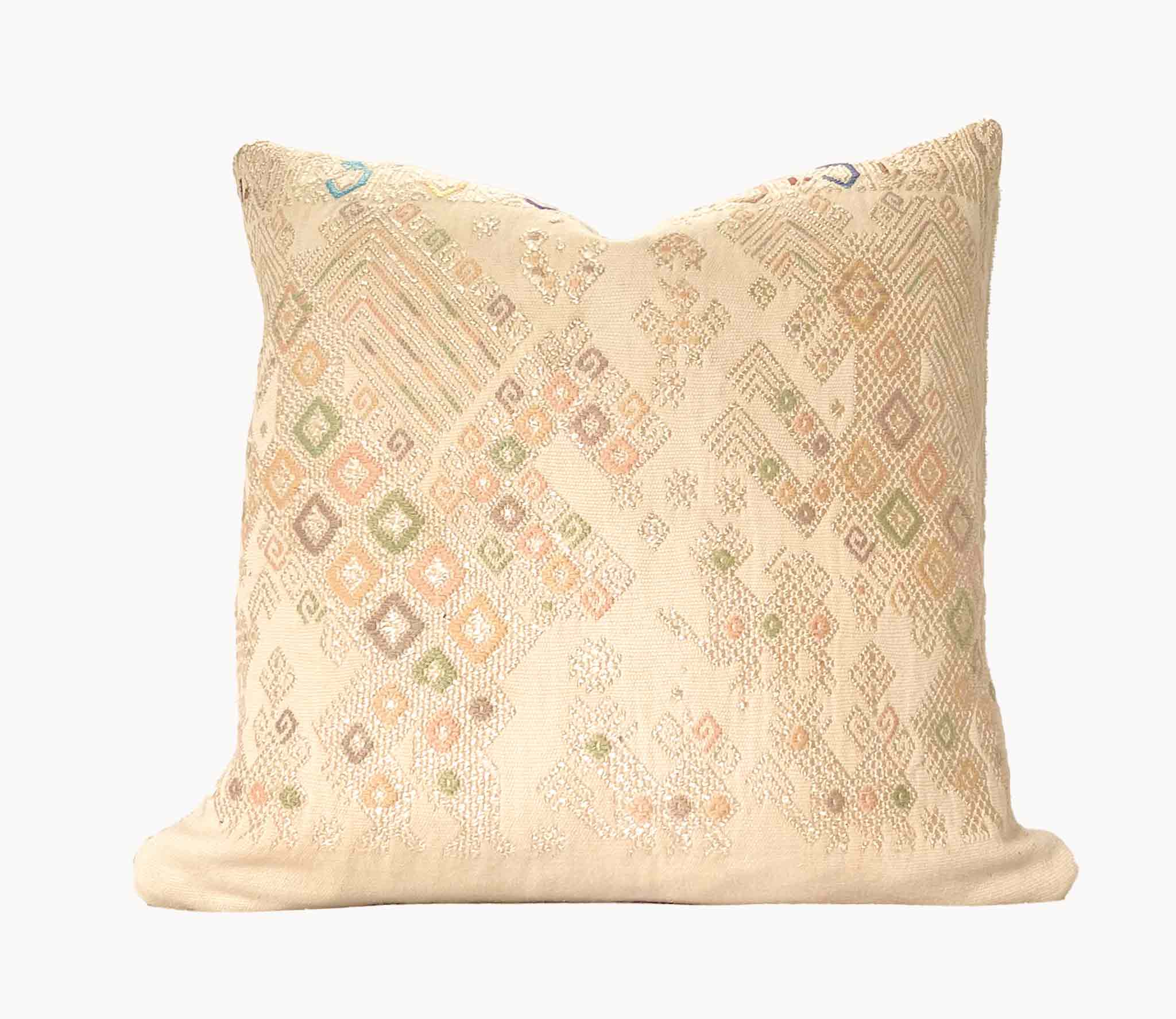 Embroidered Guatemalan huipil textile repurposed into a pillow