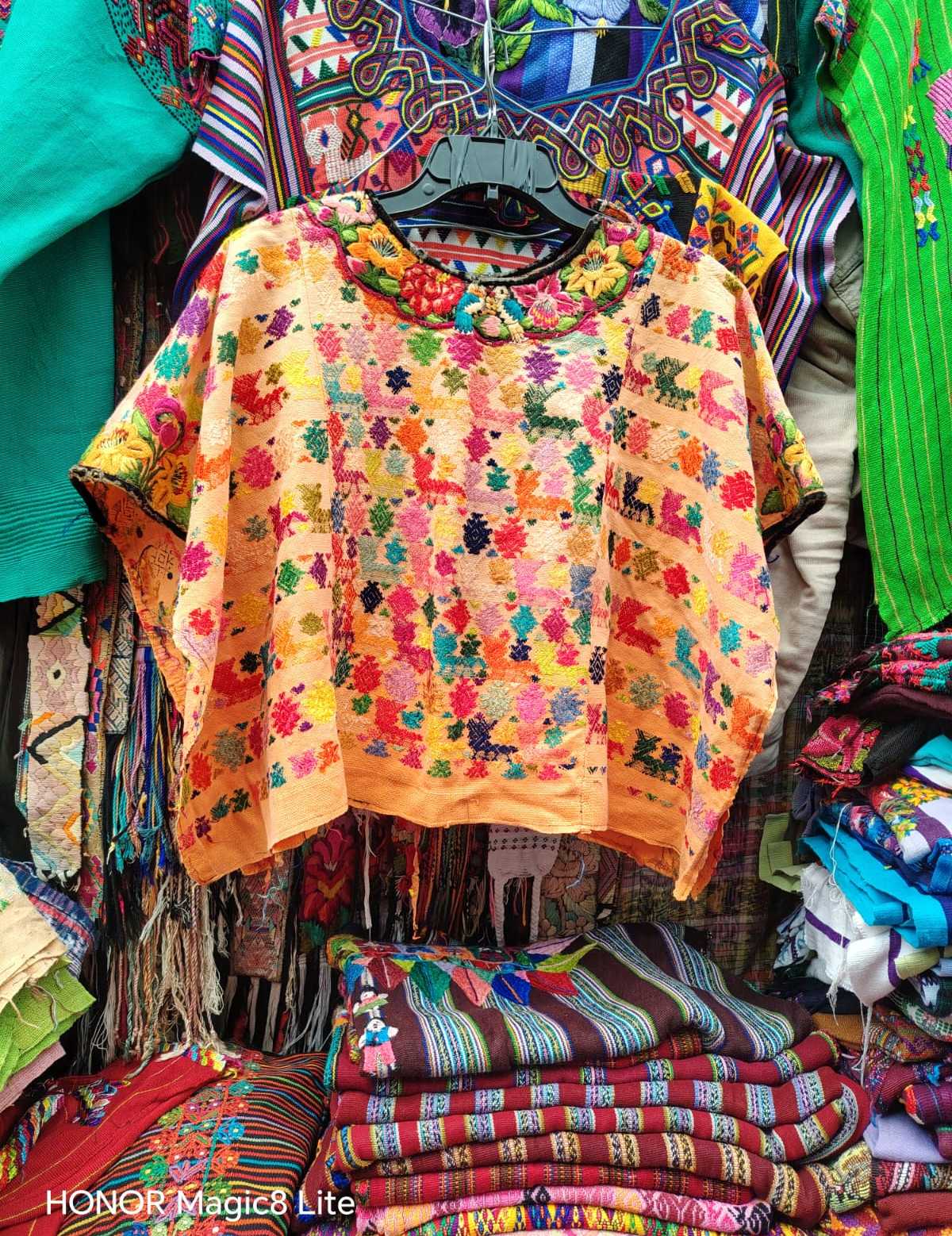 Colourful on pale orange Coban huipil #4-116