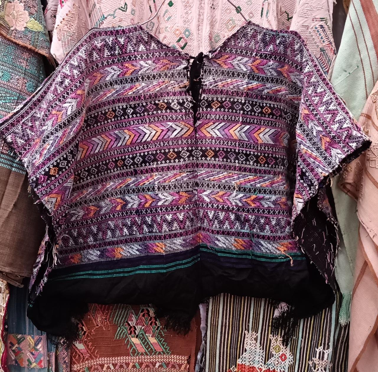 Embroidered Guatemalan huipil textile repurposed into a pillow