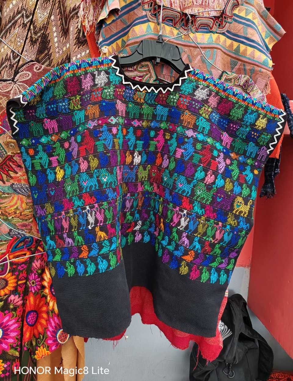 Black with animal motifs Coban huipil #5-184