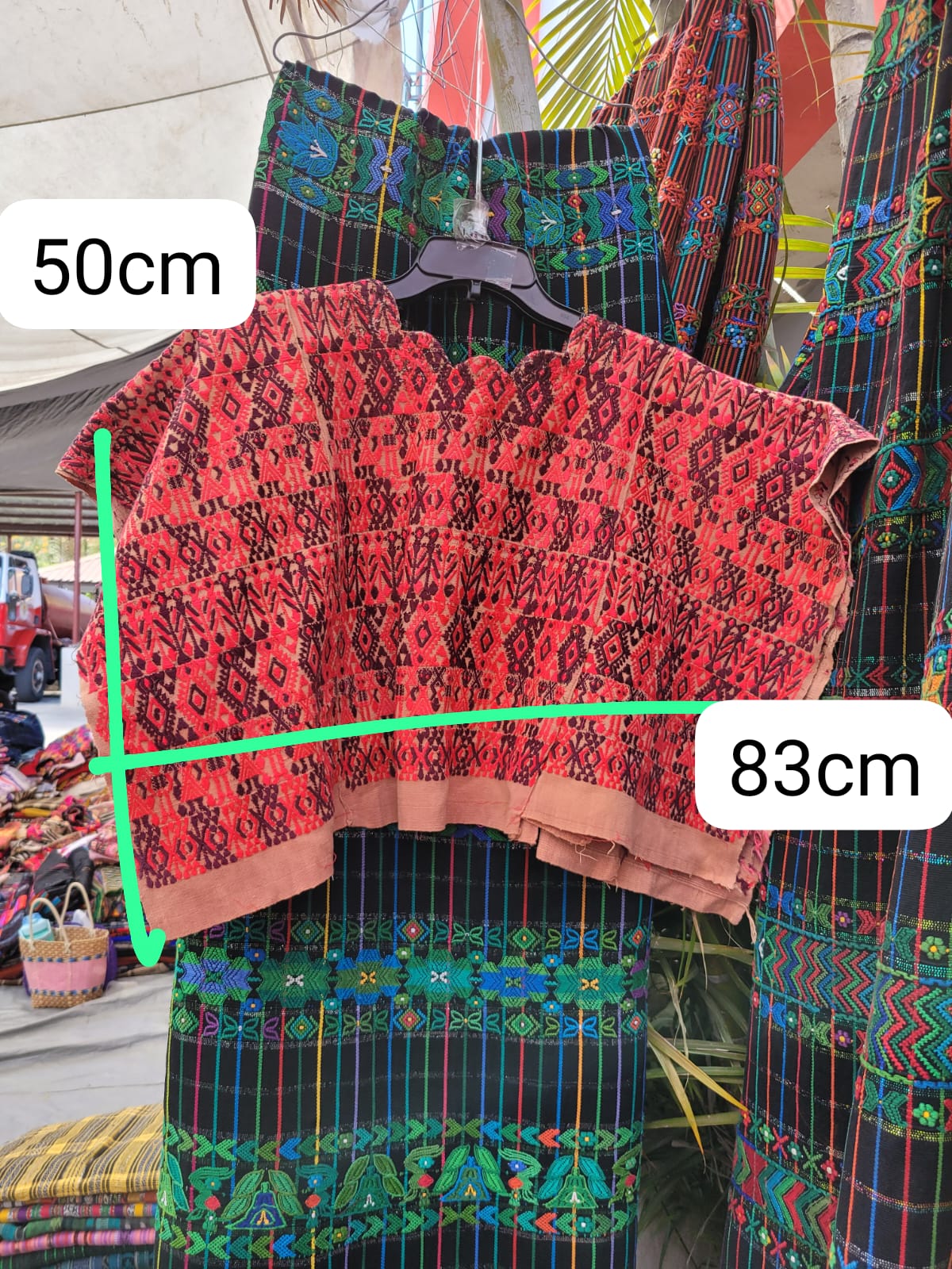 Pink and plum Coban huipil for April