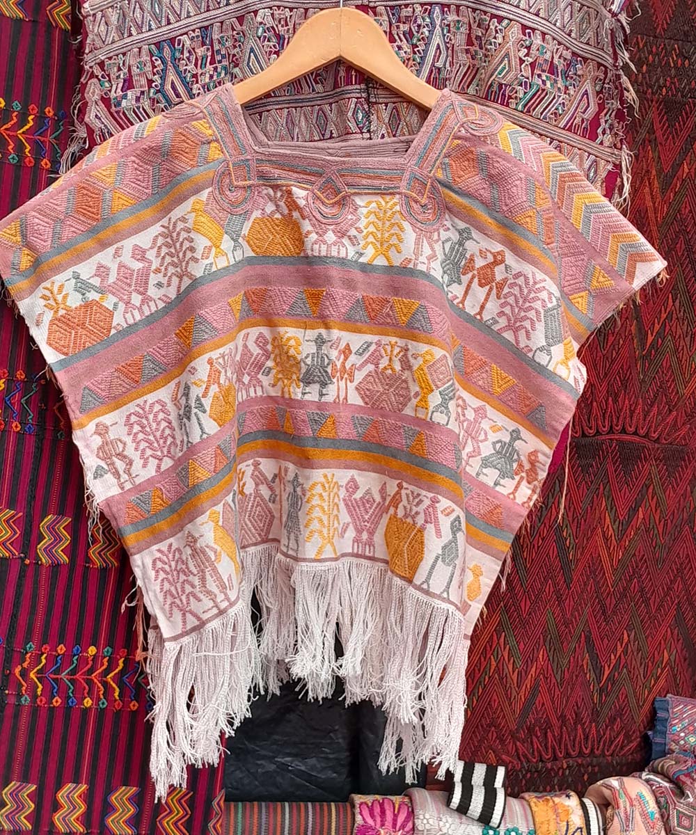 Playful Nebaj huipil on white