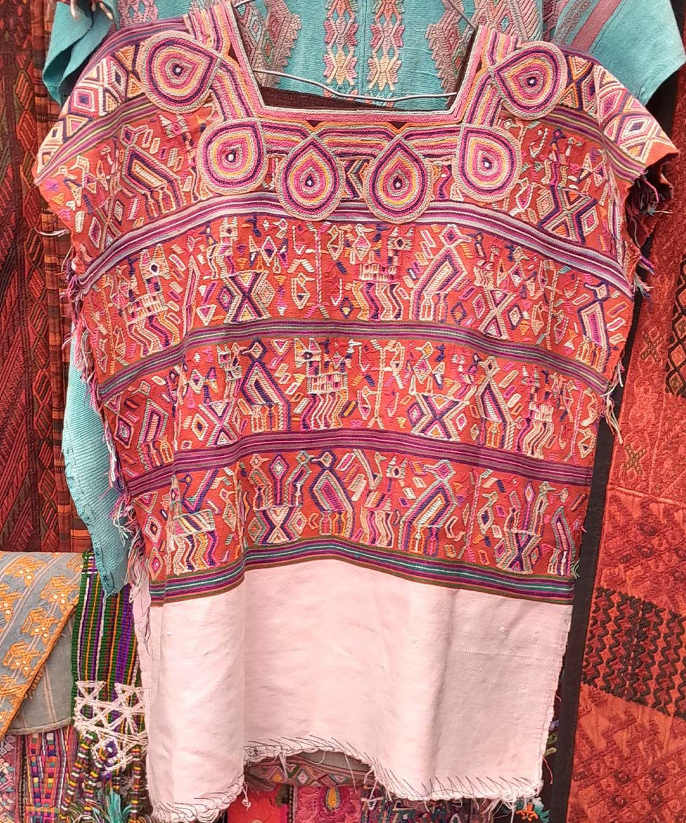 Bright red and white Nebaj huipil