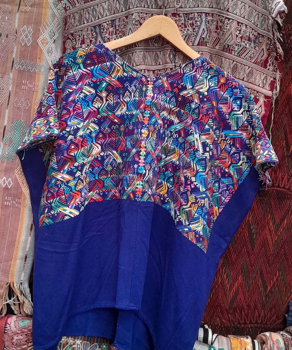 Bright blue Nahuala huipil with small quetzales