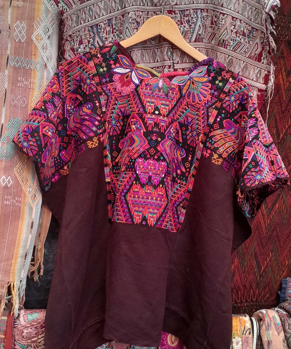 Maroon Chichi huipil with geometrics and quetzales