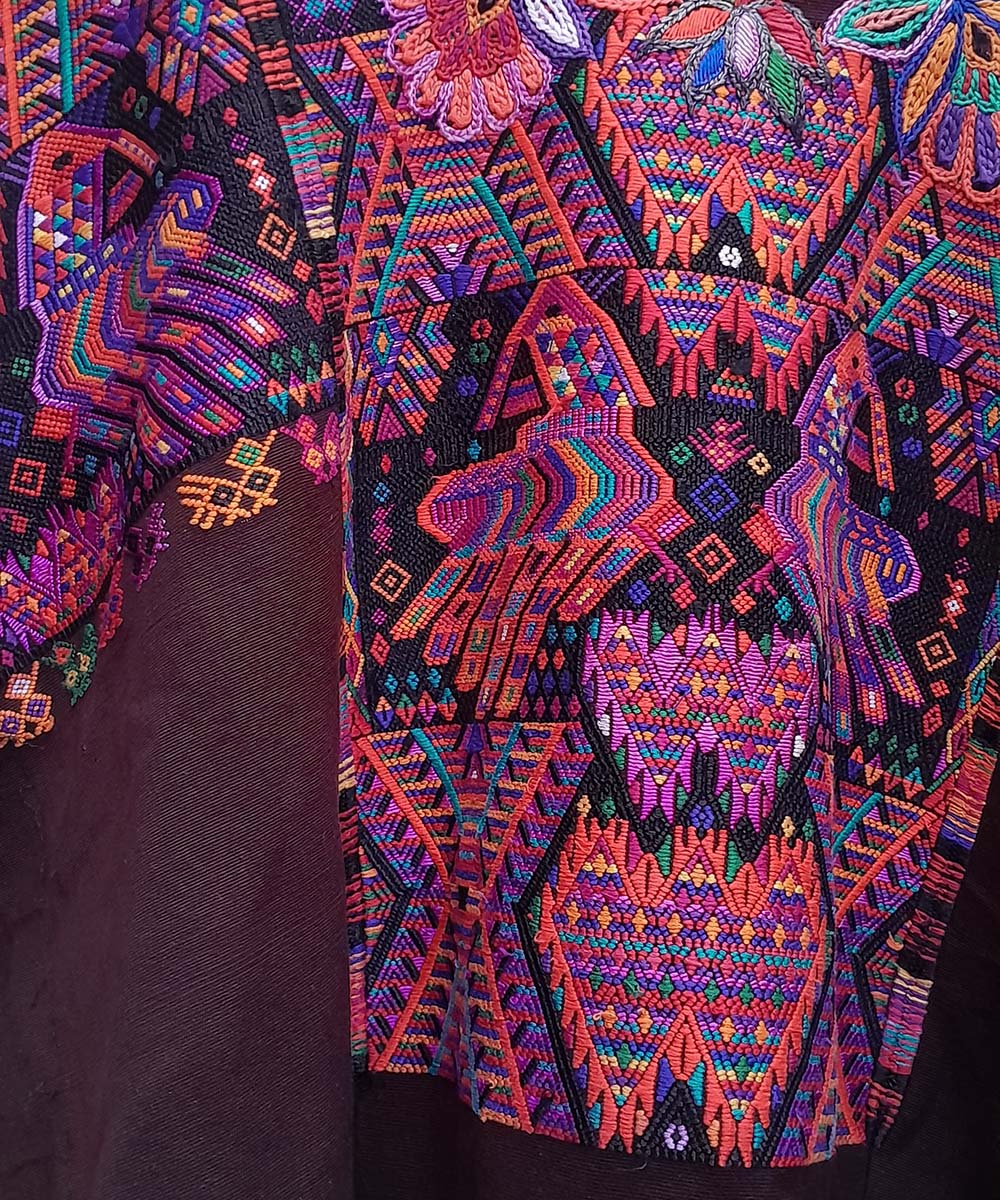 Maroon Chichi huipil with geometrics and quetzales