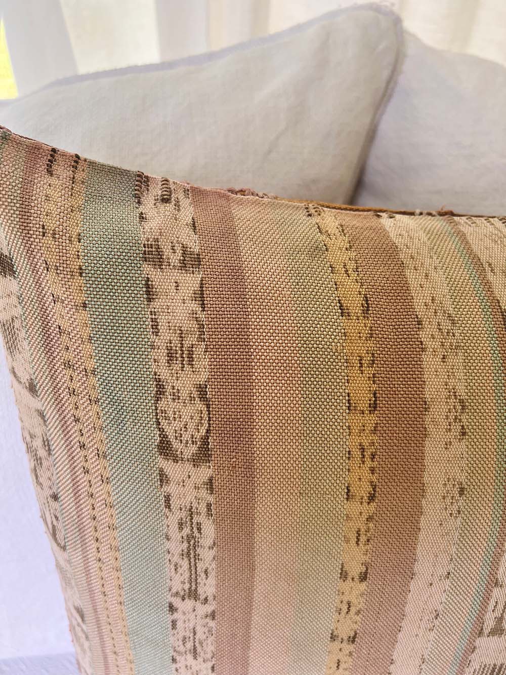 Embroidered Guatemalan huipil textile repurposed into a pillow