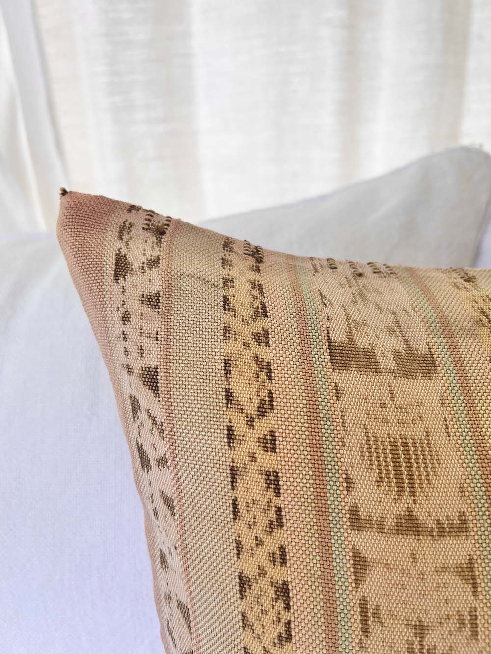 Embroidered Guatemalan huipil textile repurposed into a pillow