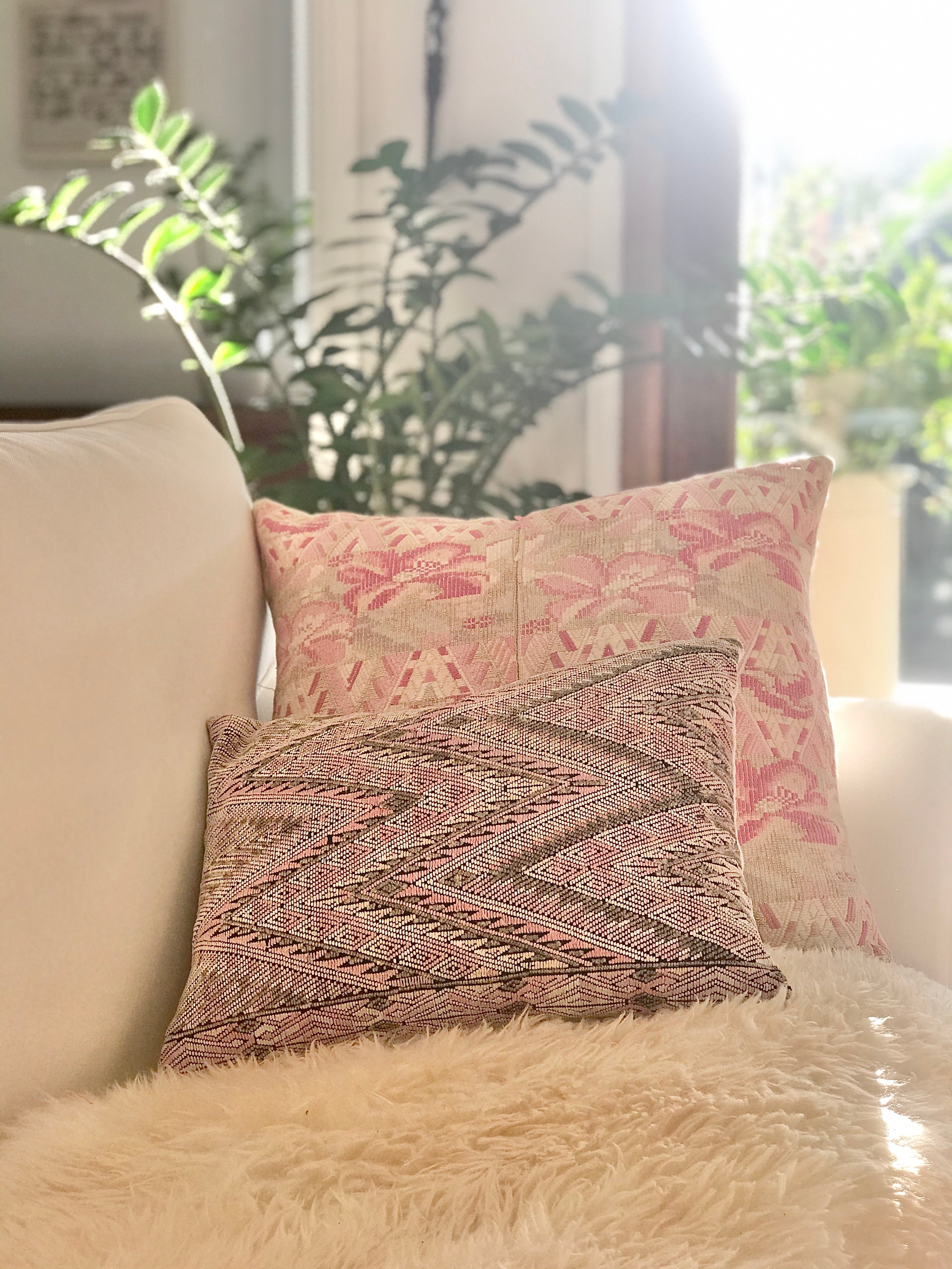 Guatemalan embroidered huipil pillow. Geometric chevron pattern in a pale pink palette.