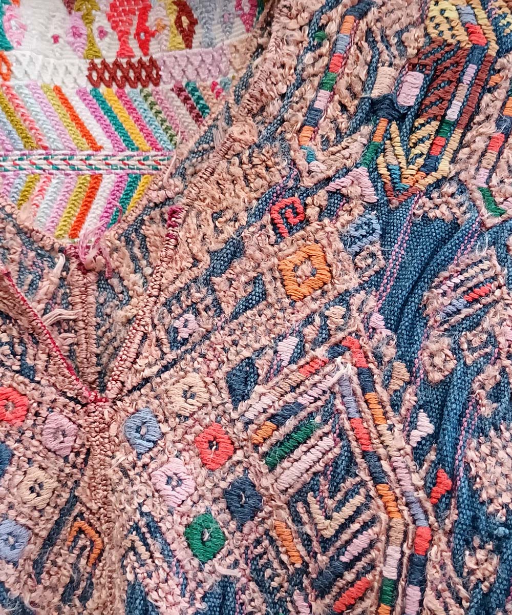 Indigo Nahuala huipil with stylised quetzales