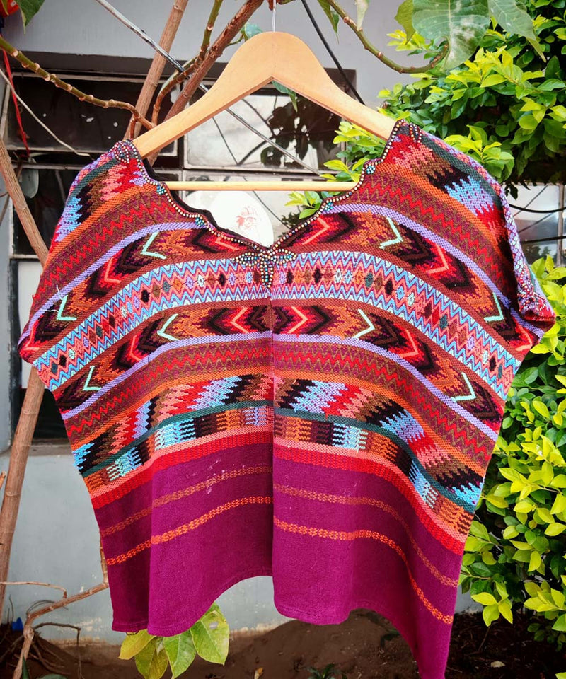 Fuchsia and orange Comalapa huipil
