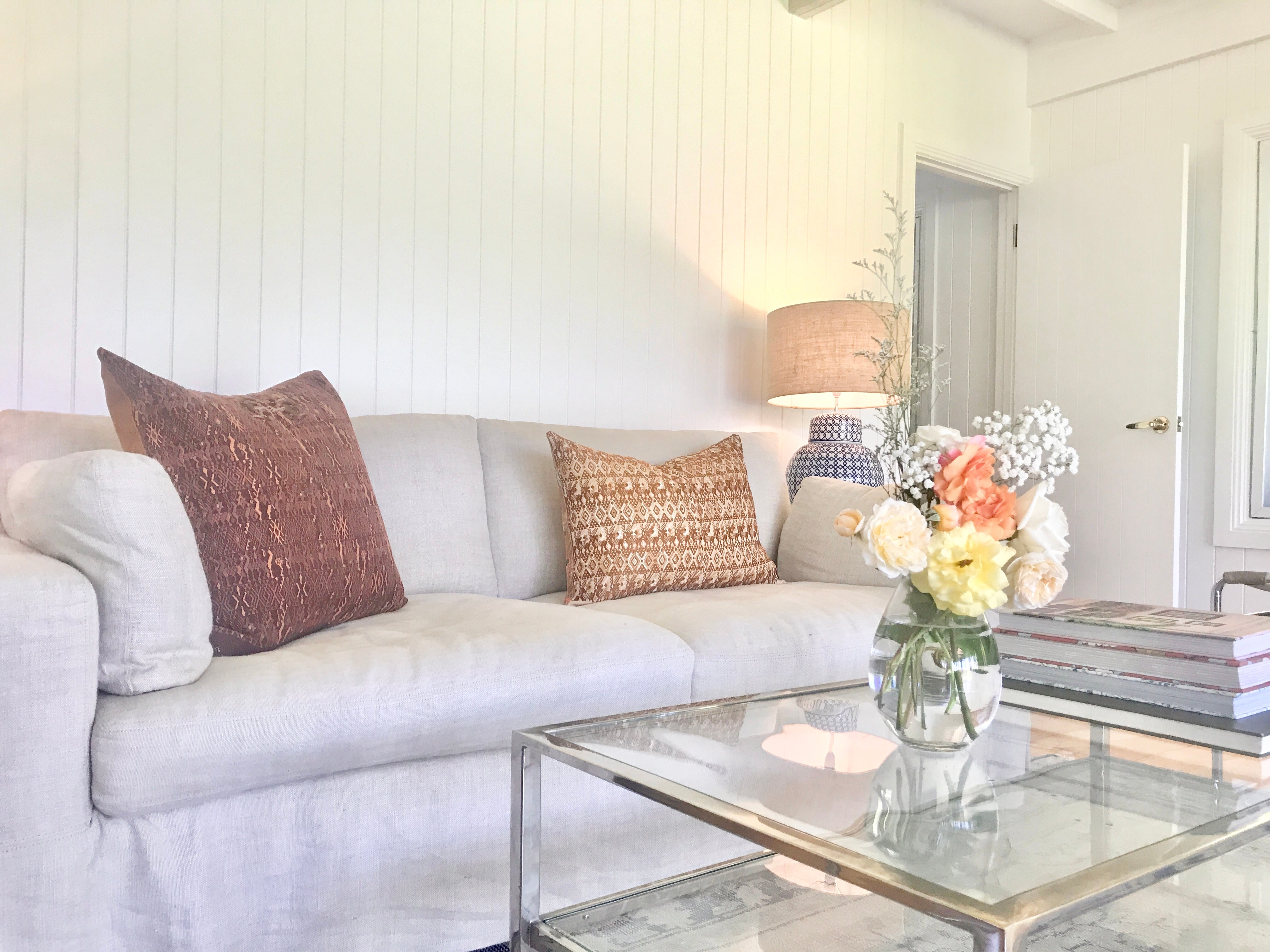 Embroidered textile cushions made from a Guatemalan huipil and corte.