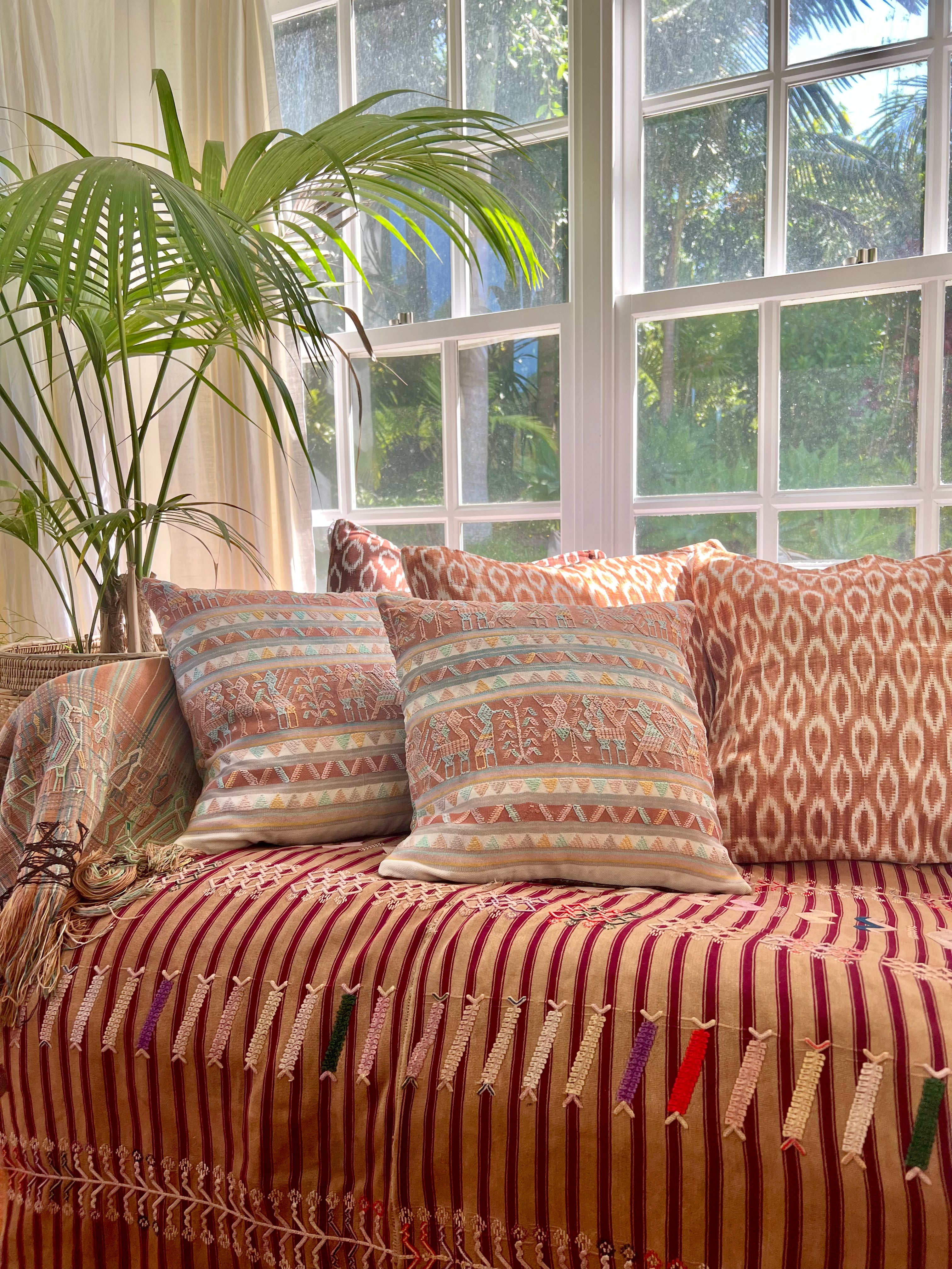 Embroidered Guatemalan huipil textile repurposed into a pillow