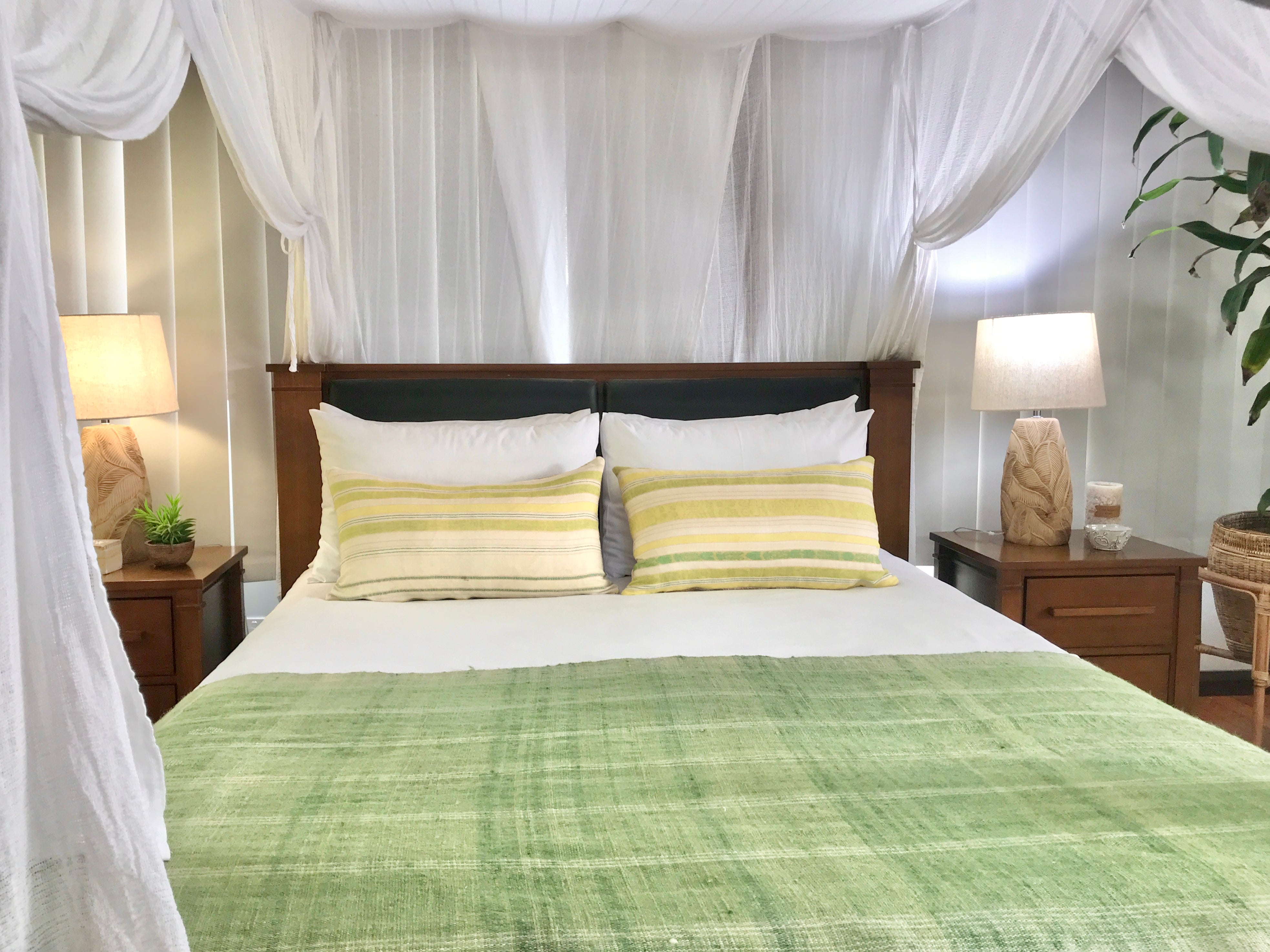 Embroidered textile cushions made from a Guatemalan huipil and corte.