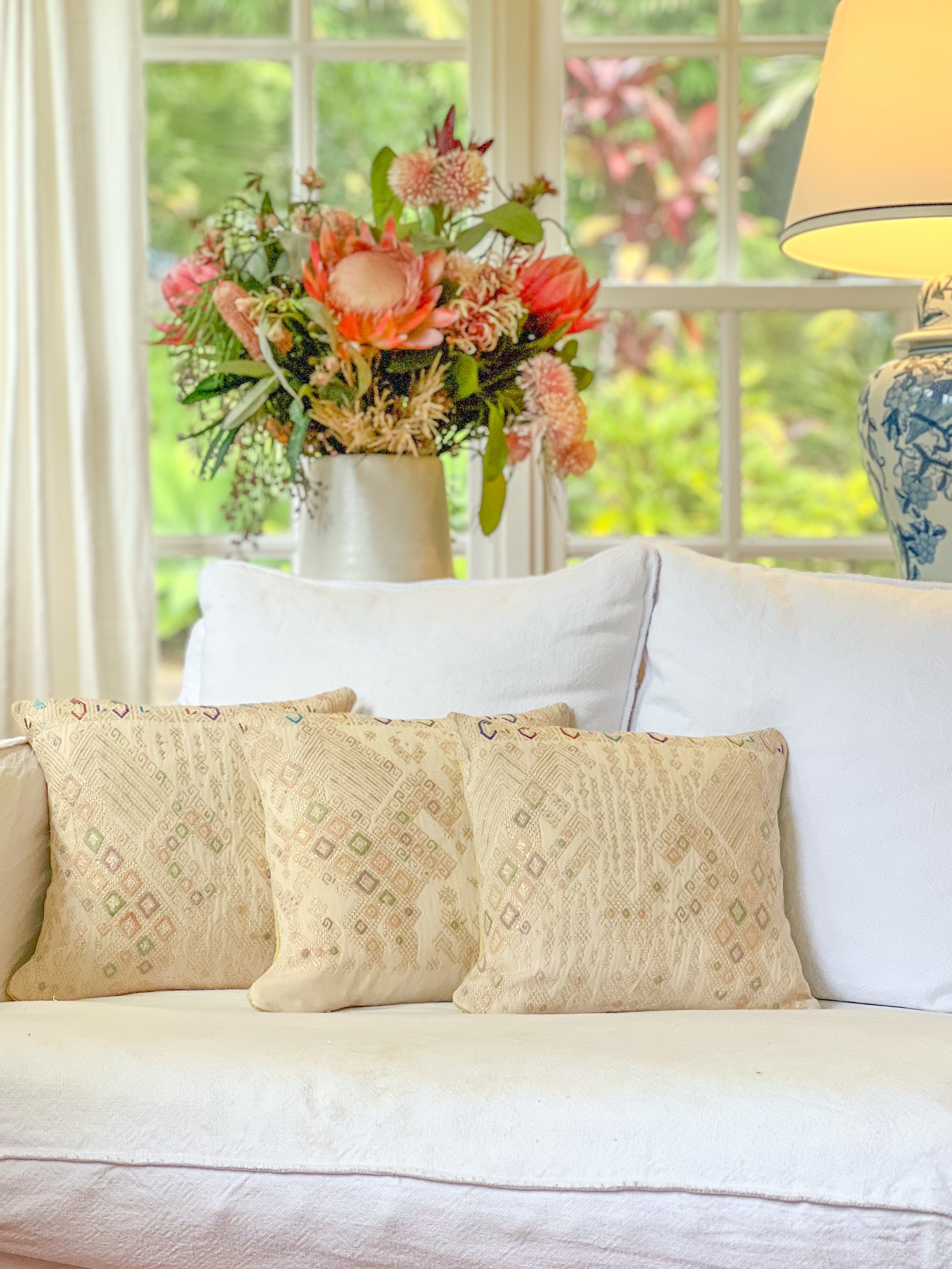 Embroidered Guatemalan huipil textile repurposed into a pillow