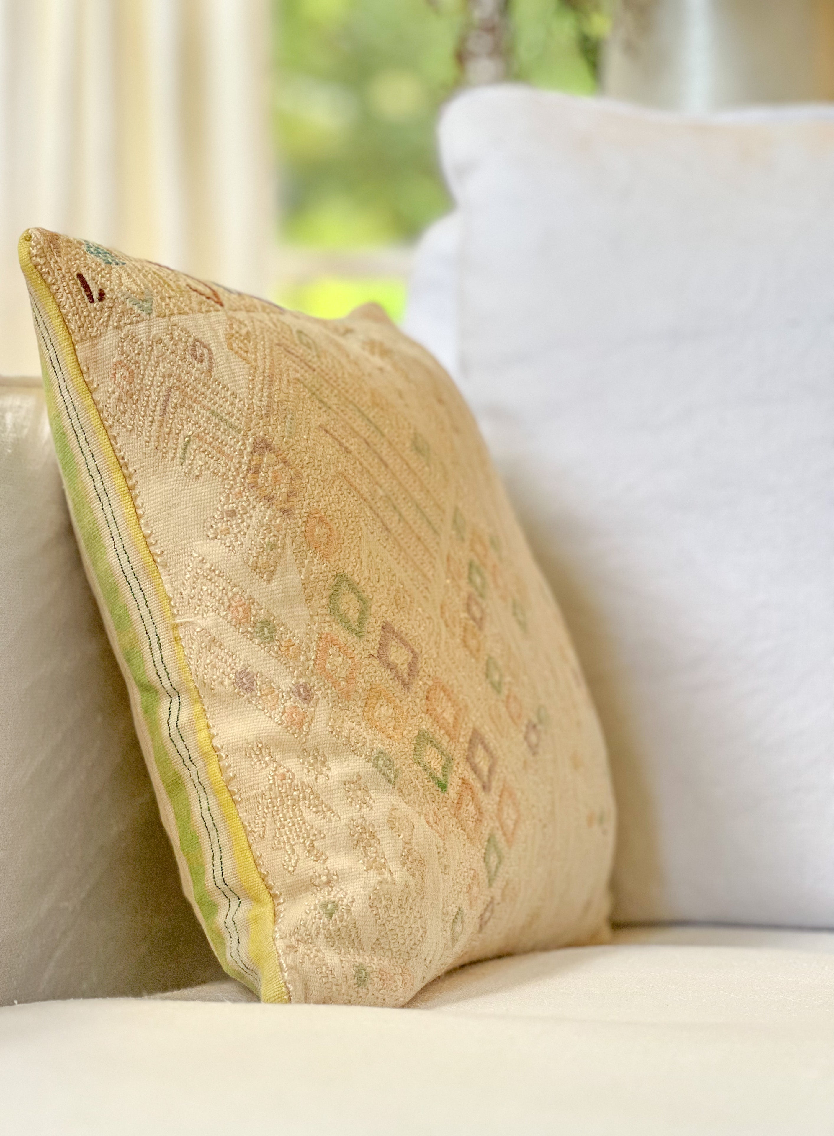 Embroidered Guatemalan huipil textile repurposed into a pillow