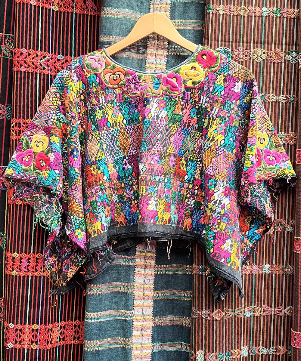 Colorful Coban huipil with elaborate neckline