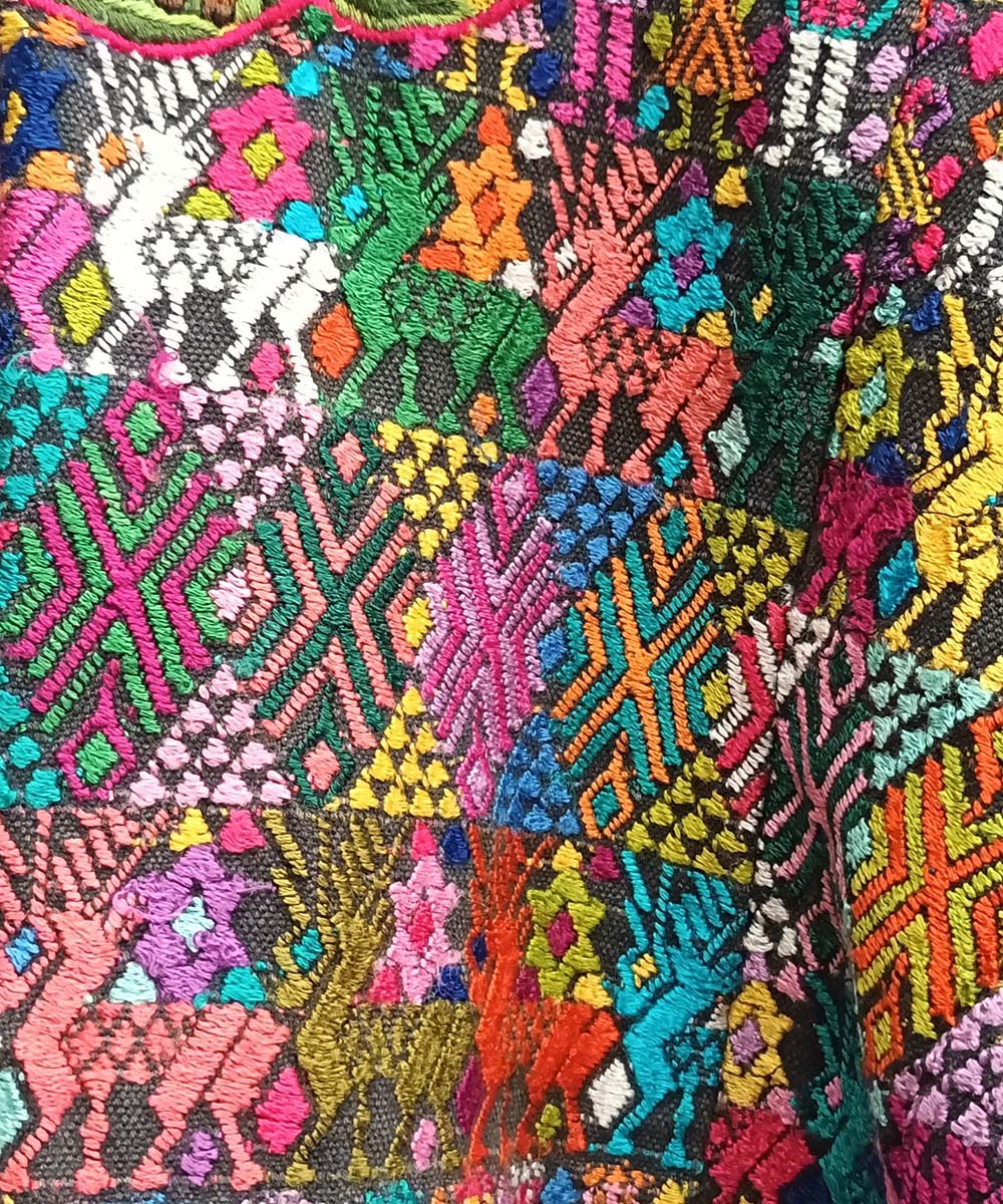 Colorful Coban huipil with elaborate neckline