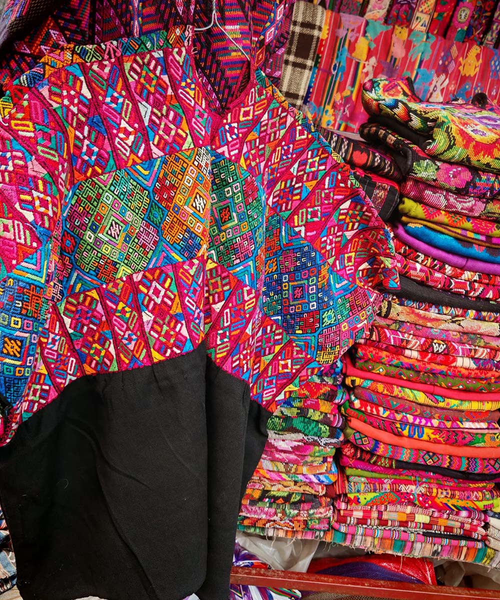 Colorful red and black Nahuala huipil