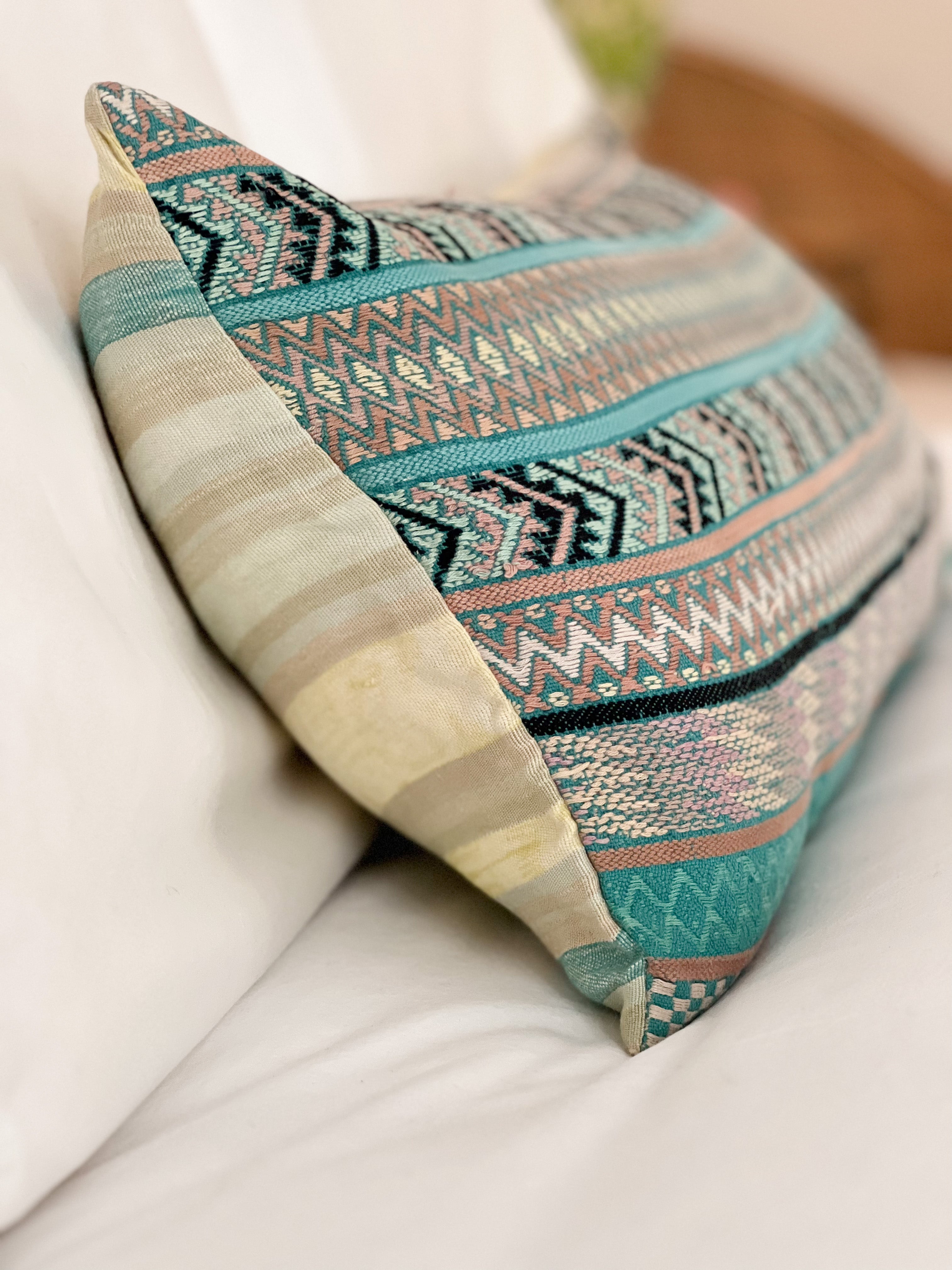 Embroidered Guatemalan huipil textile repurposed into a pillow