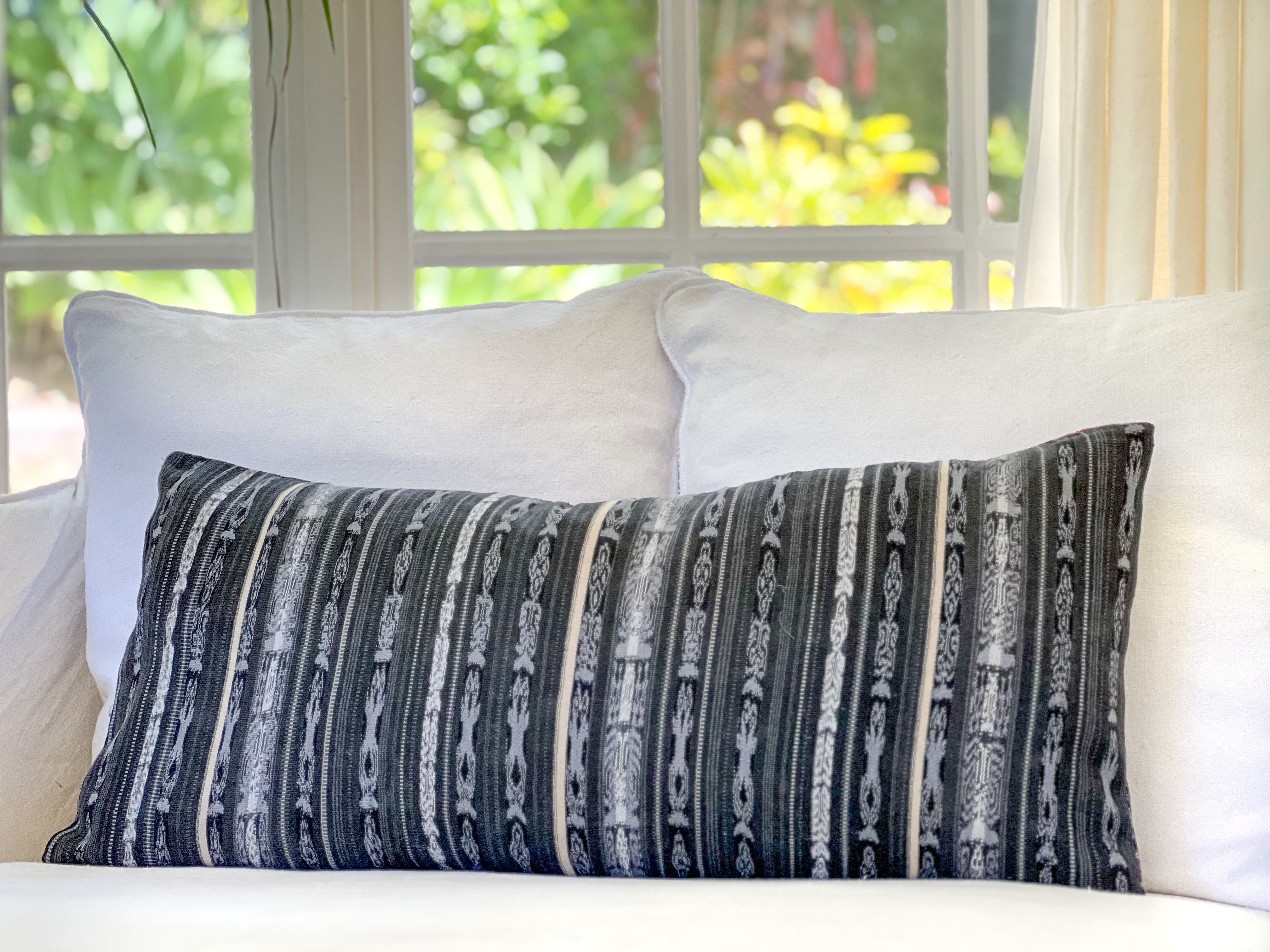 Embroidered Guatemalan huipil textile repurposed into a pillow