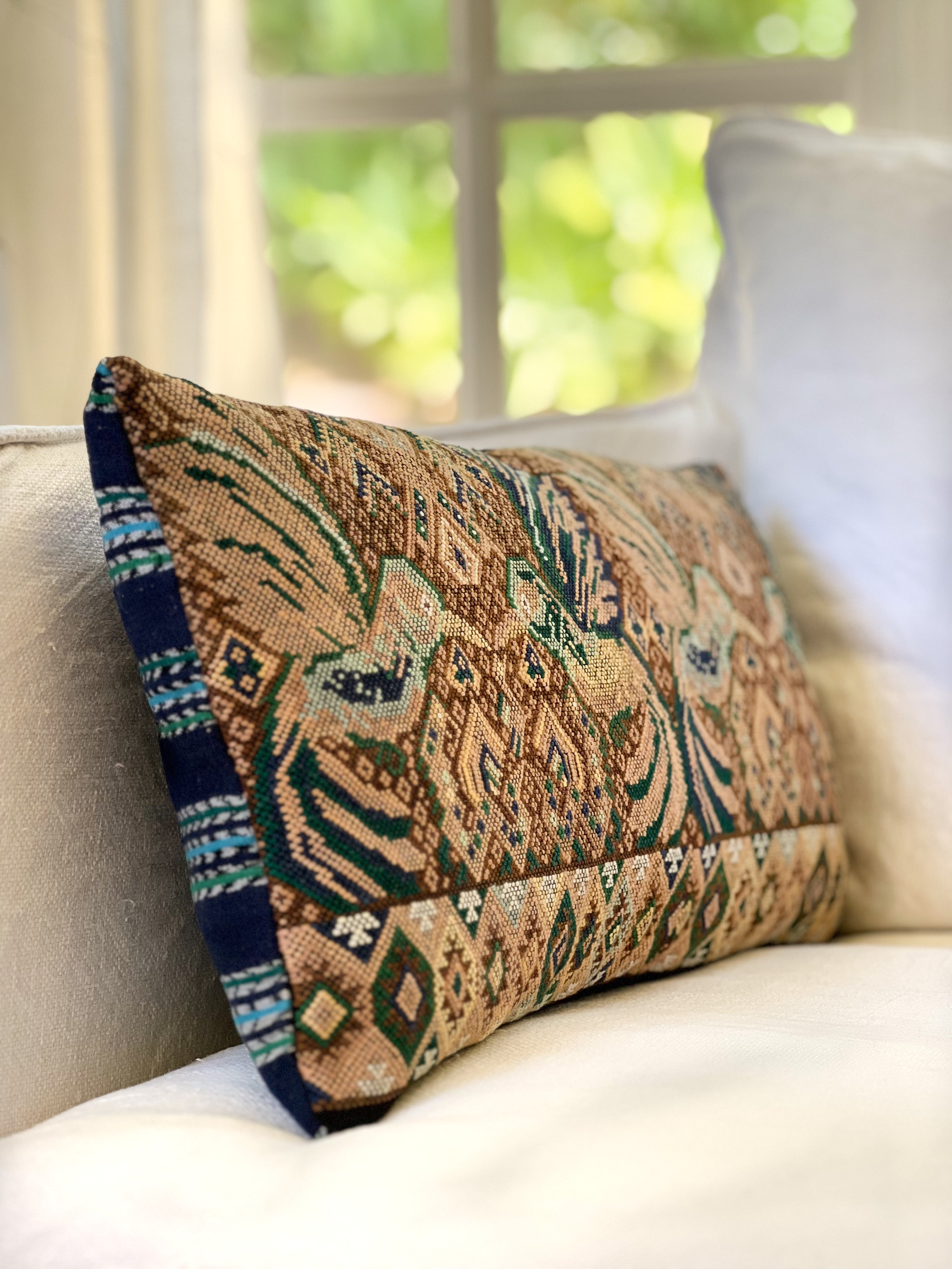 Embroidered Guatemalan huipil textile repurposed into a pillow