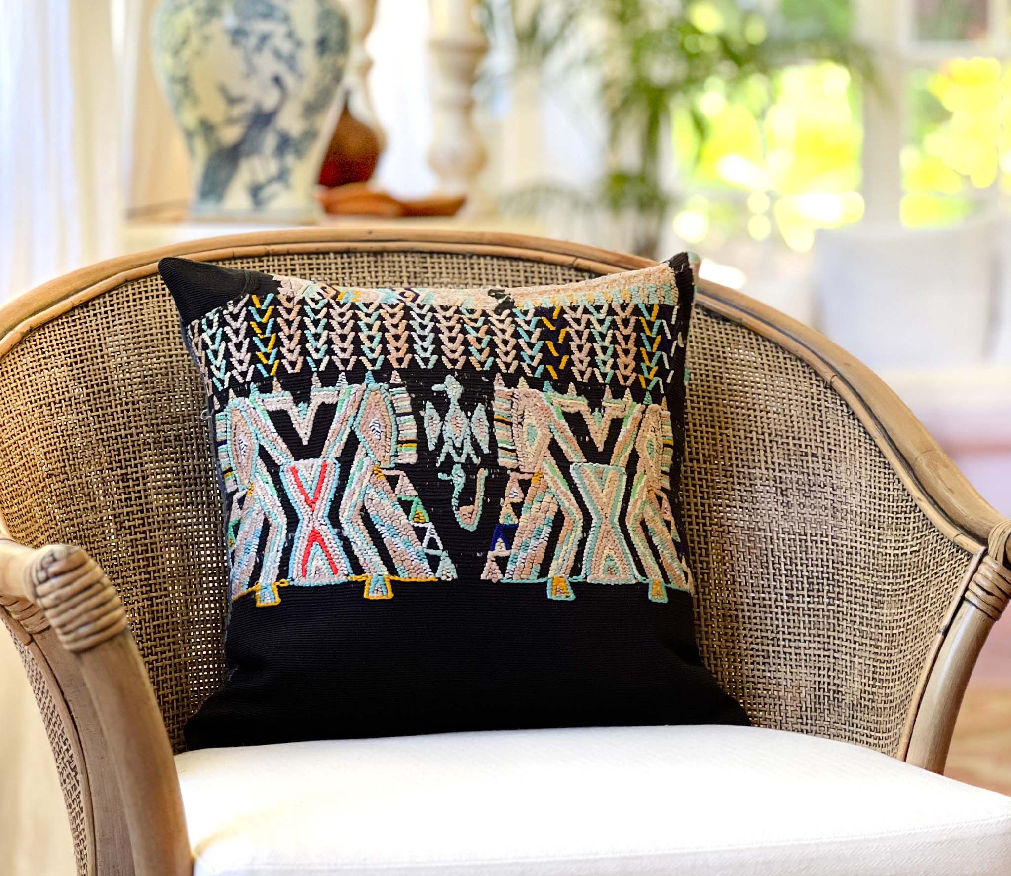Embroidered Guatemalan huipil textile repurposed into a pillow