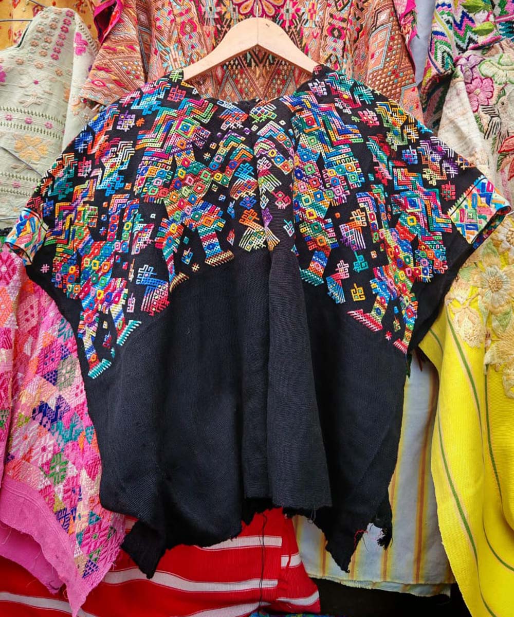 Colorful on black Nahuala huipil with horses
