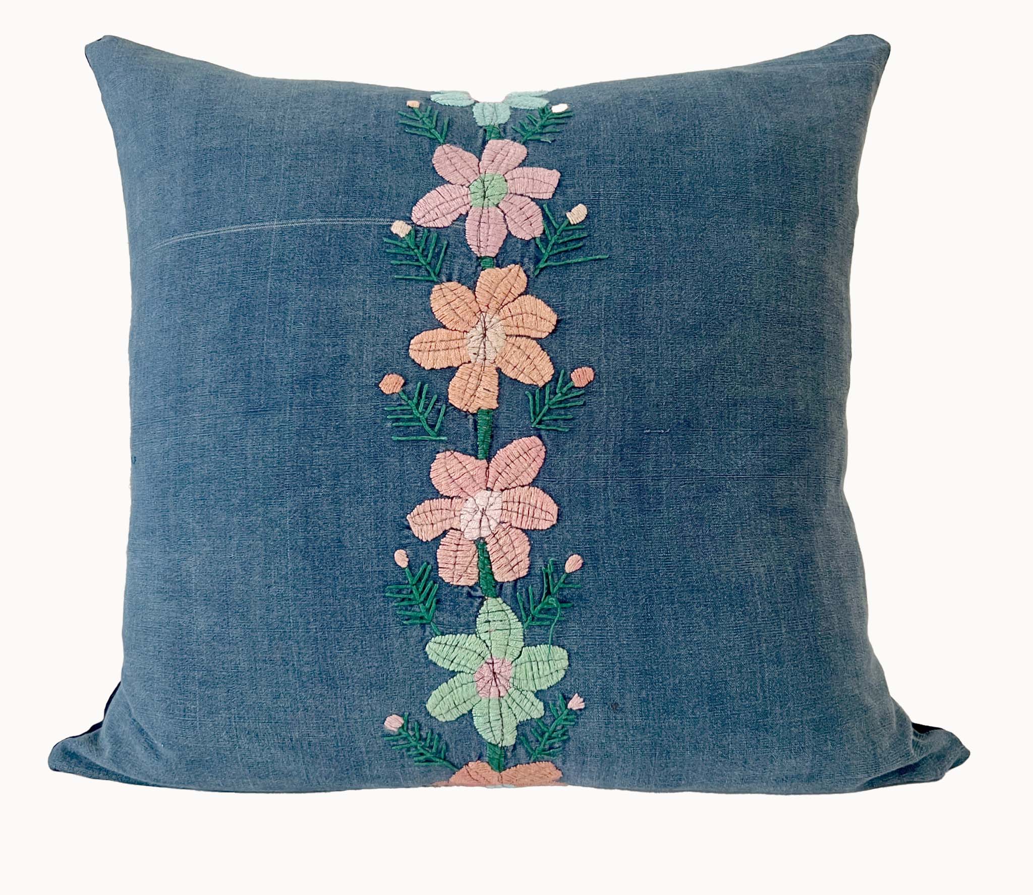 Embroidered Guatemalan huipil textile repurposed into a pillow