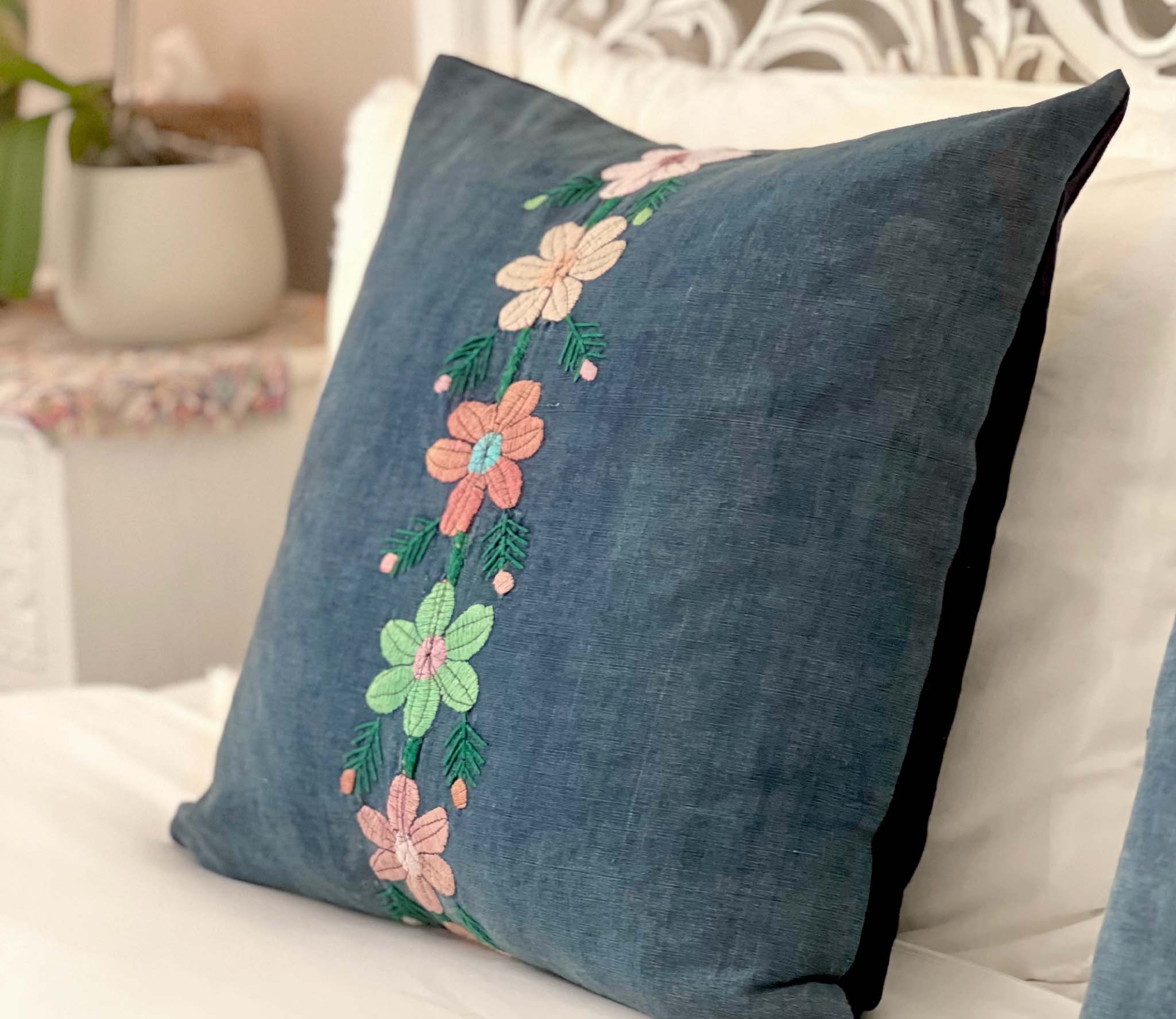 Embroidered Guatemalan huipil textile repurposed into a pillow