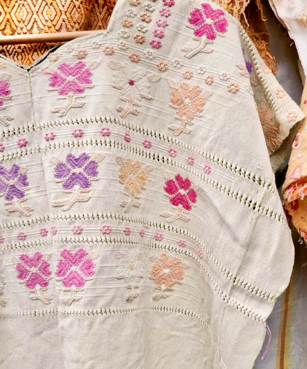 Pink and purple flowered huipil