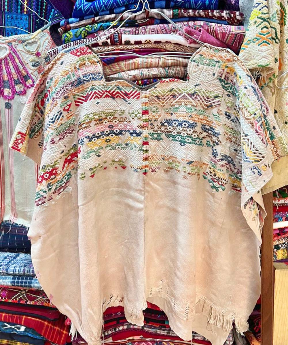 Colorful on ivory Nahuala huipil