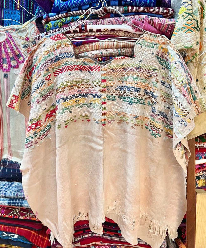 Colorful on ivory Nahuala huipil
