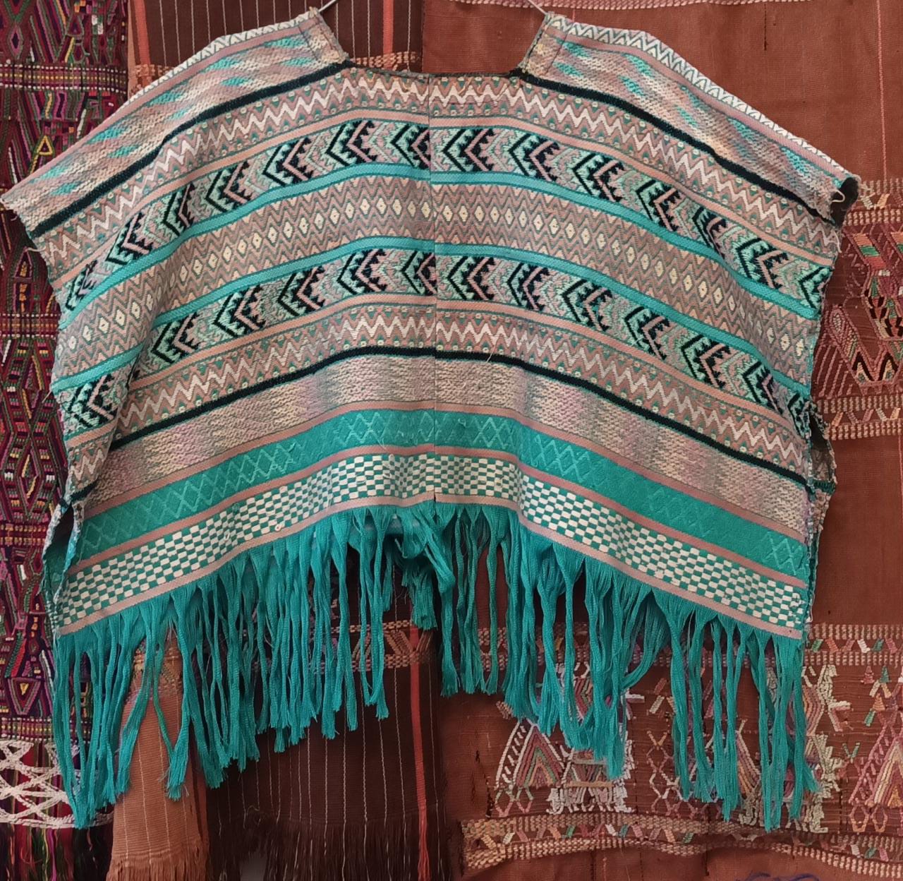 Embroidered Guatemalan huipil textile repurposed into a pillow