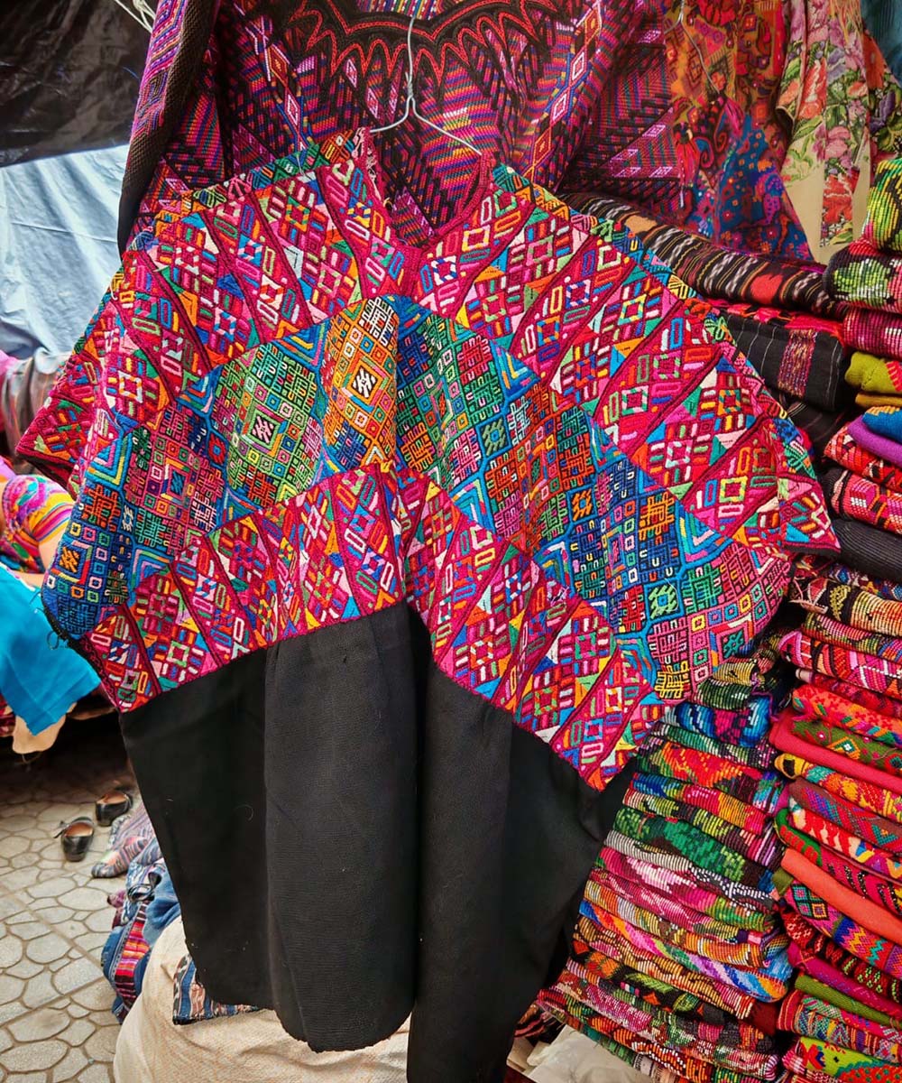 Colorful red and black Nahuala huipil