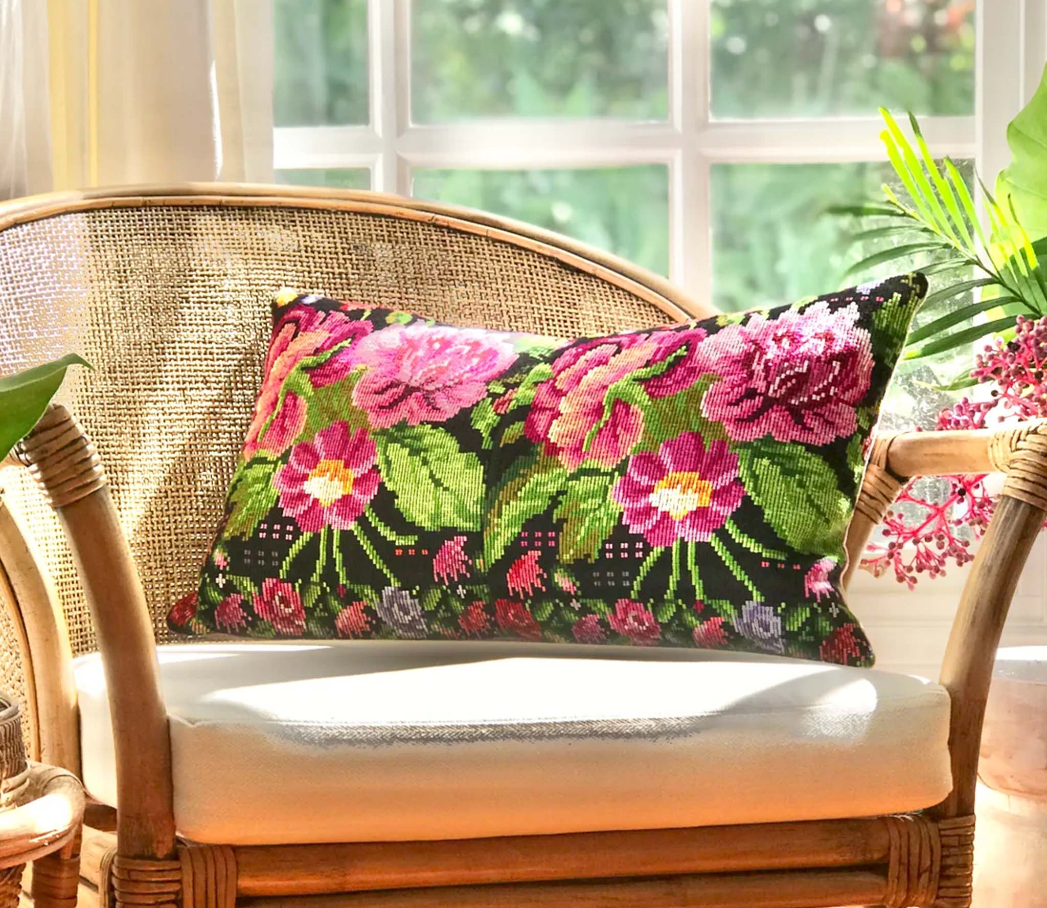 Embroidered textile cushions made from a Guatemalan huipil and corte.