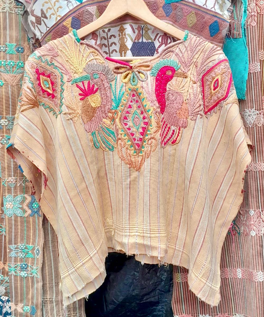 Guatemalan huipil from Chichi with stylized peacocks