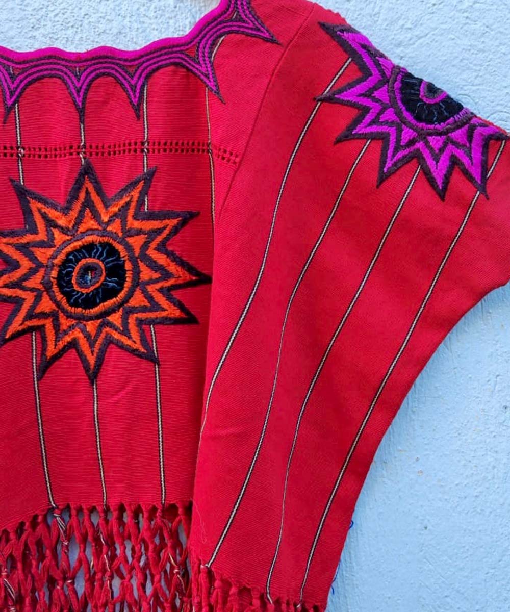 Bright red huipil with fringe