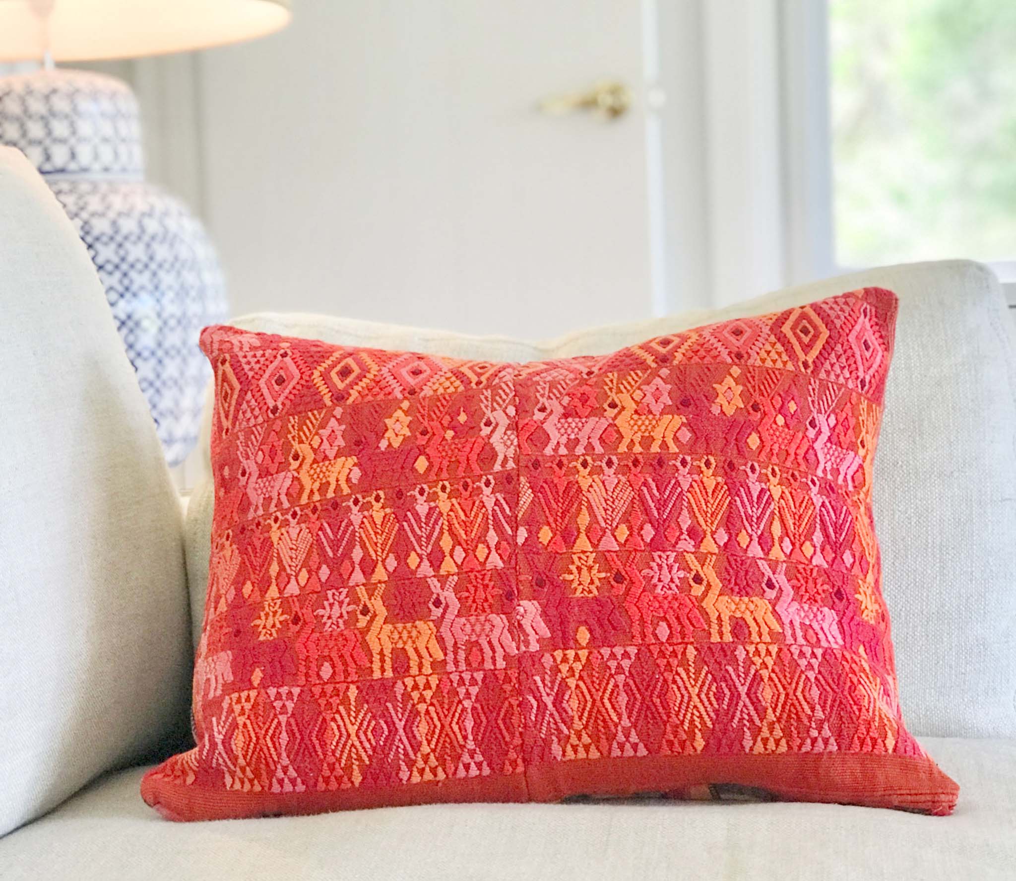 Vintage textile cushion made from a Guatemalan huipil and corte