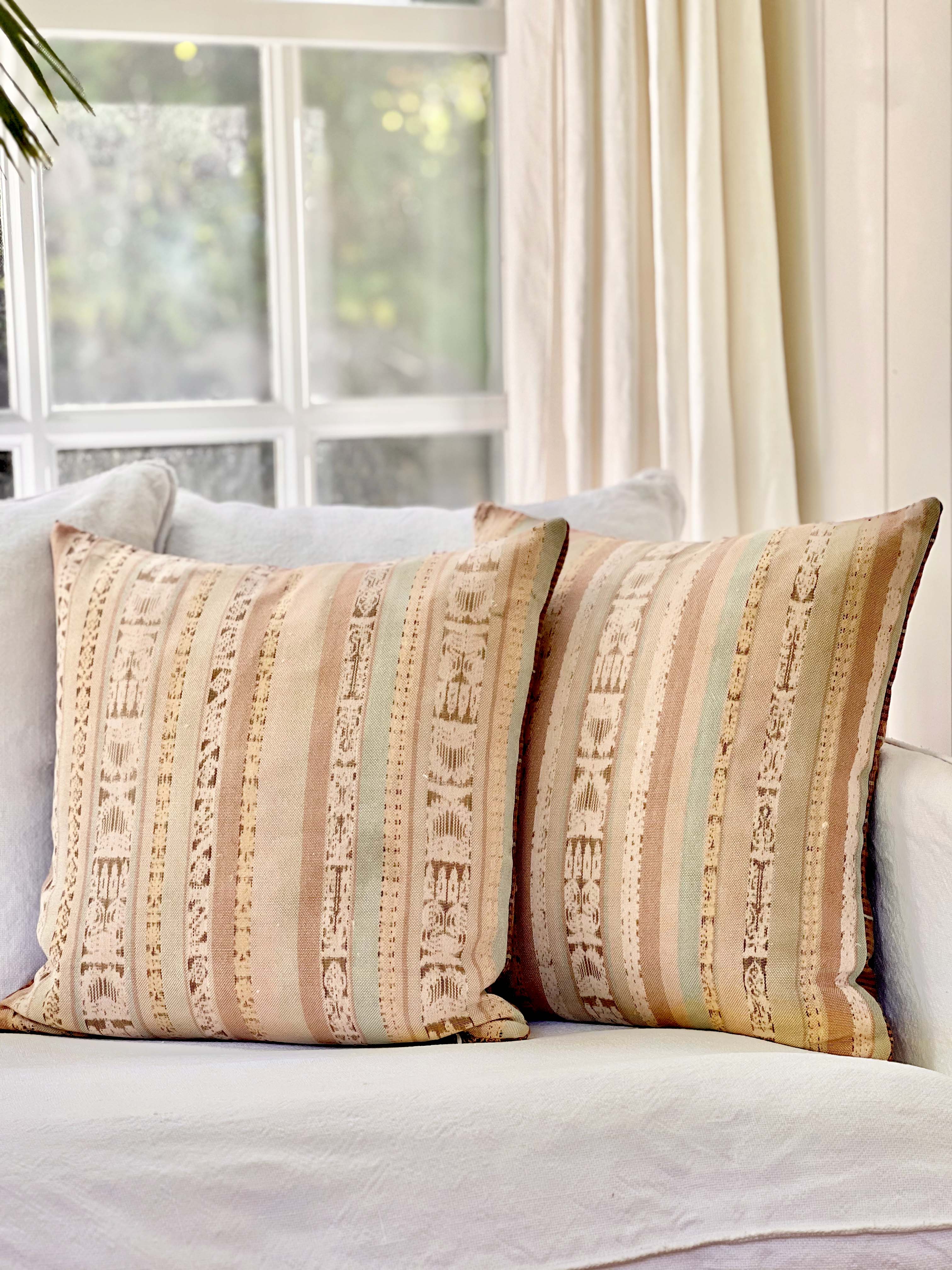 Embroidered Guatemalan huipil textile repurposed into a pillow