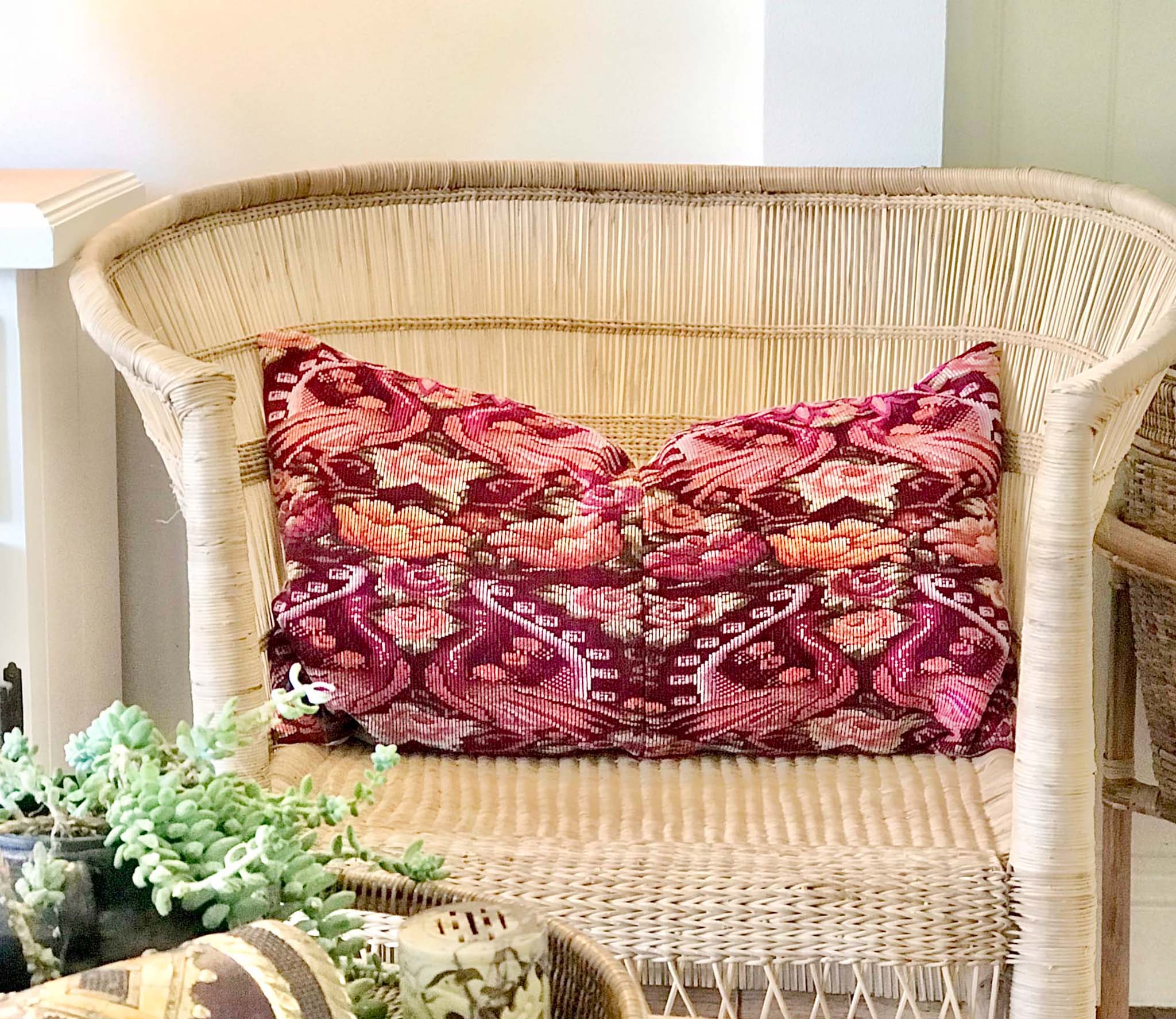 Guatemalan embroidered huipil pillow. Maximilist design of flowers and peacocks in rich burgundy red.