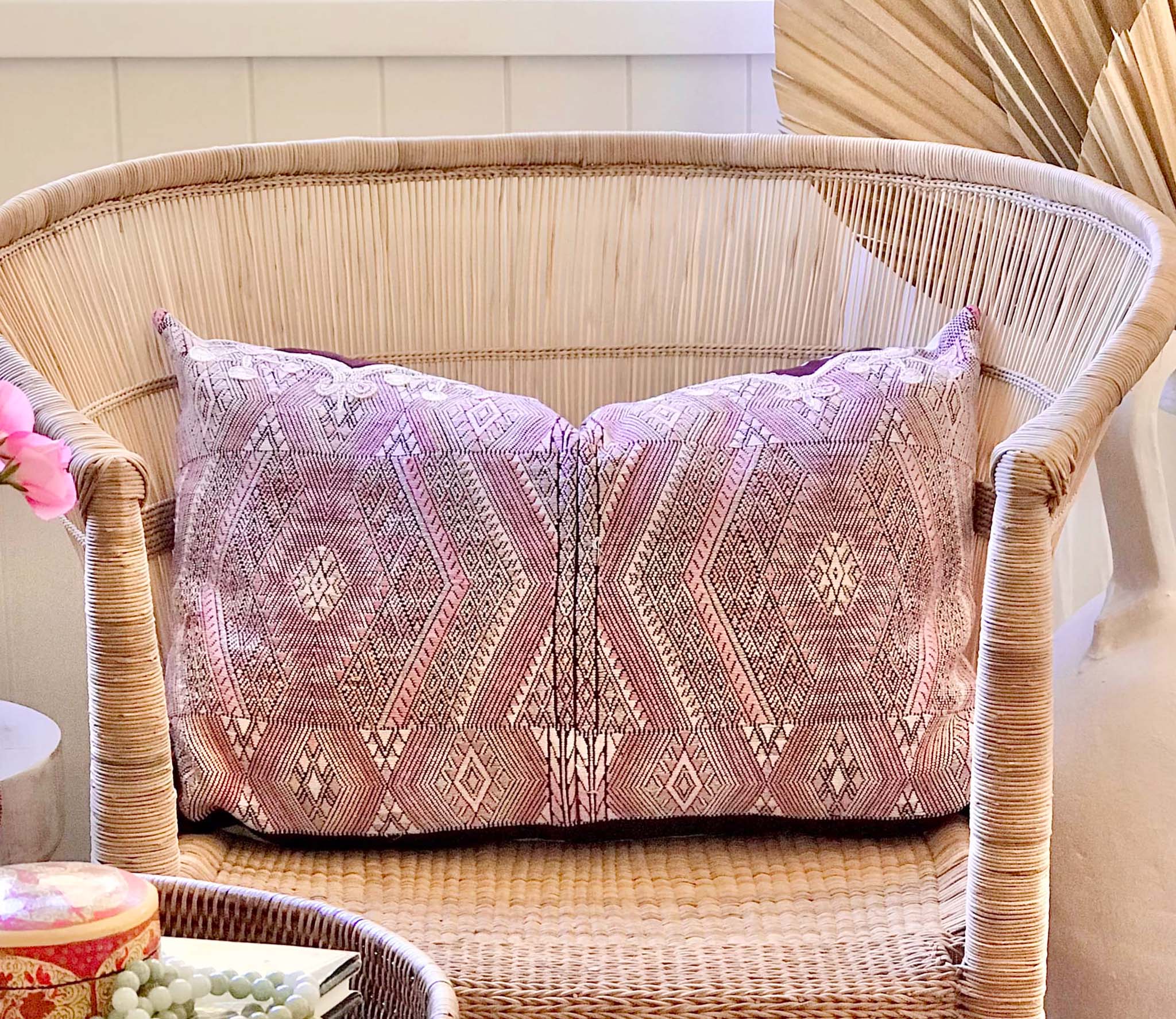 Guatemalan embroidered huipil pillow. Geometric chevron pattern in a pale pink palette.