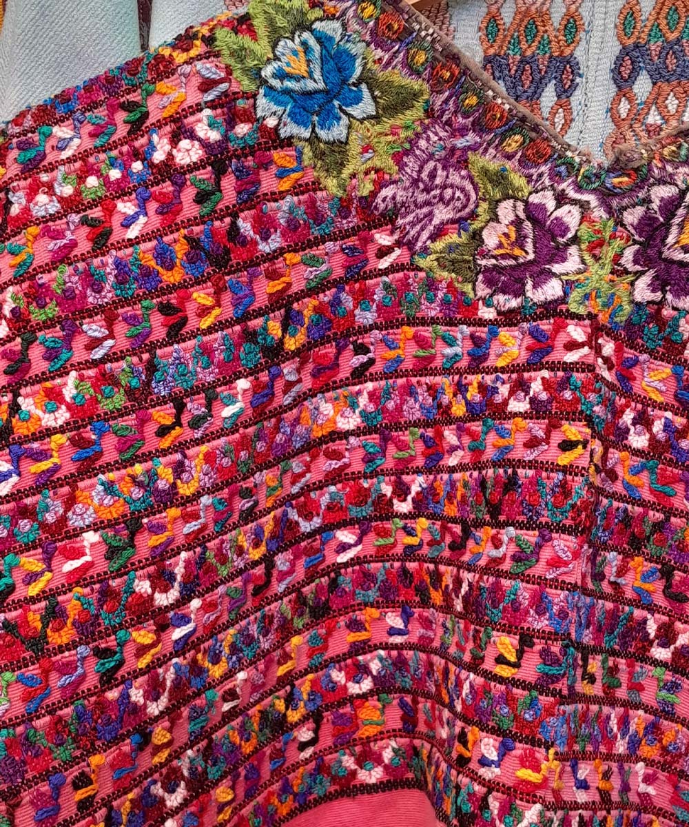 Hot pink San Lucas huipil with floral neckline