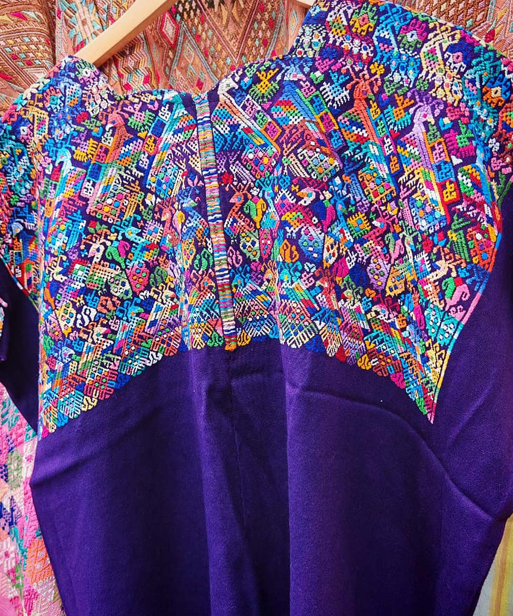 Colorful on purple Nahuala huipil