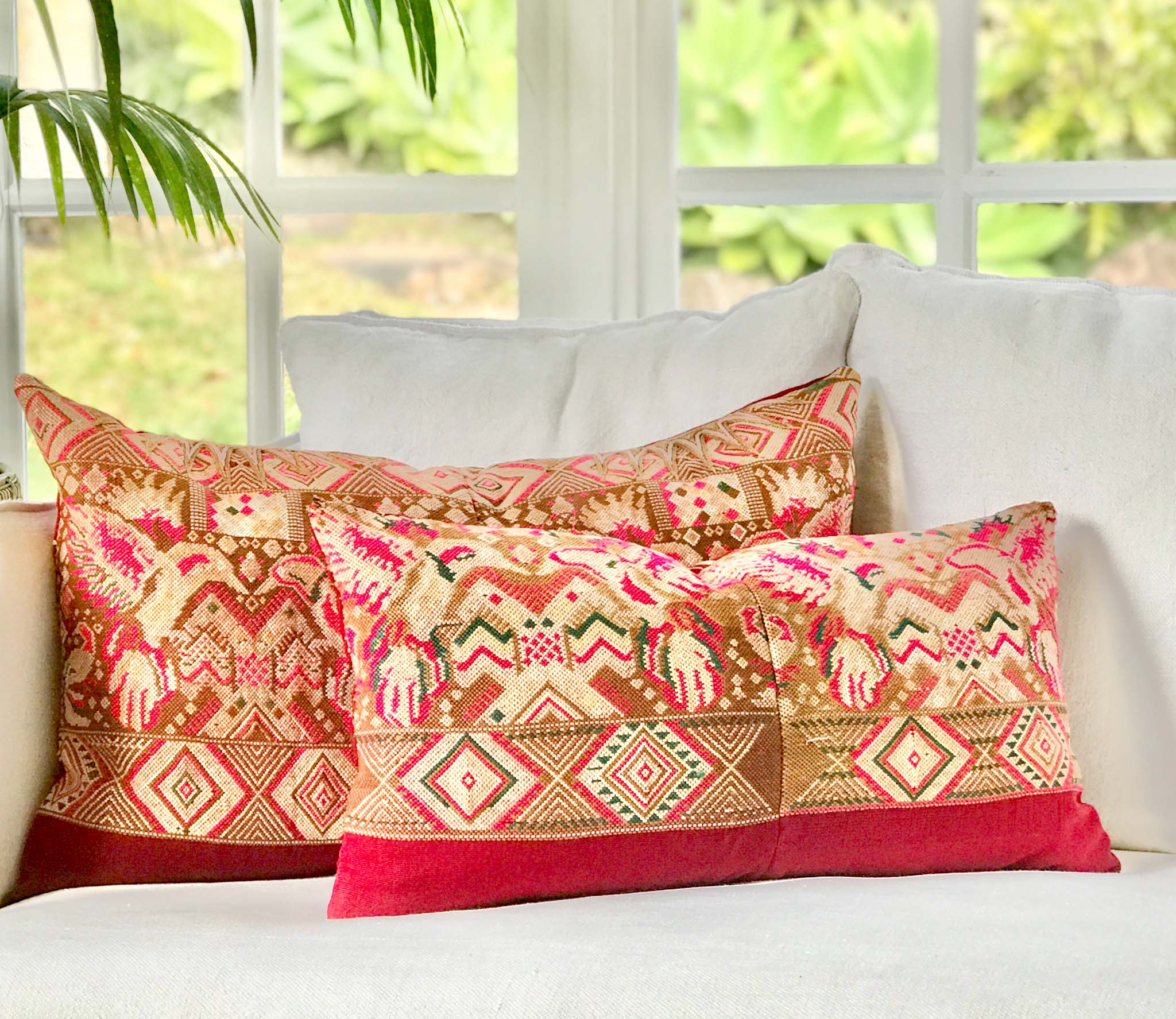 Vintage textile pillows made from a Guatemalan huipil and corte