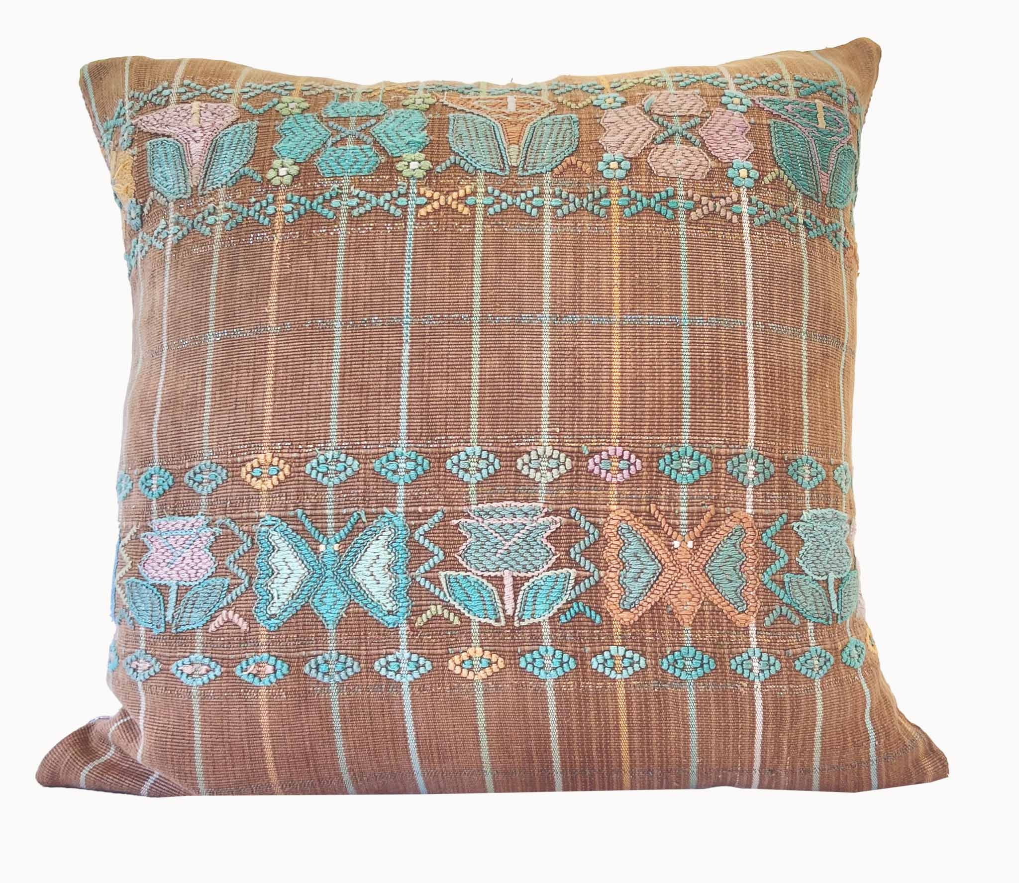 Embroidered Guatemalan huipil textile repurposed into a pillow