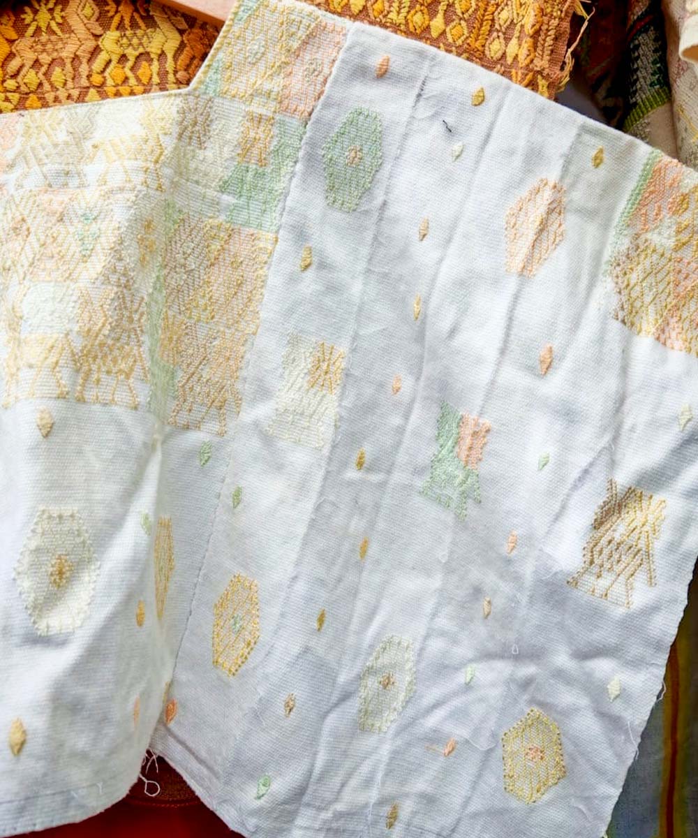 White Coban huipil with pale orange and green