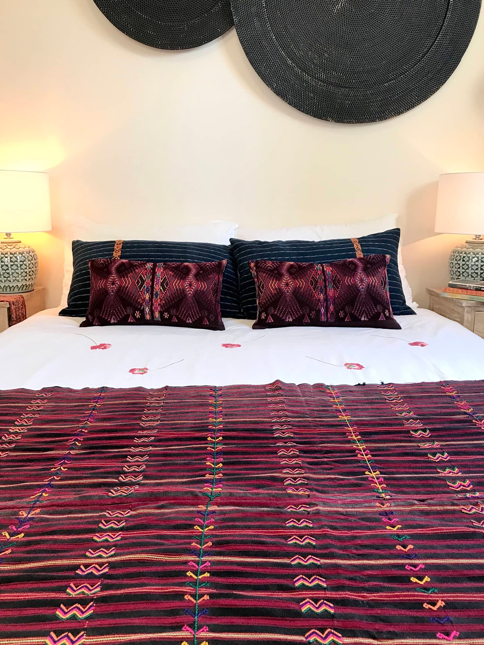 Guatemalan huipil pillow. A darkly exotic vintage textile with a stylised rising phoenix bird design.